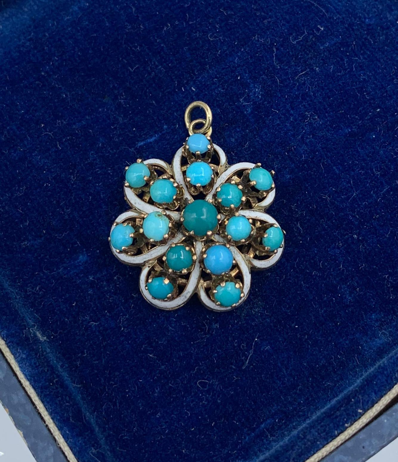This is a stunning Victorian - Art Nouveau Pendant set with fabulous Turquoise cabochons in a swirling design with White Enamel in 14 Karat Gold.  I just love this combination of the blue and green turquoise with the white enamel.  It is fresh and