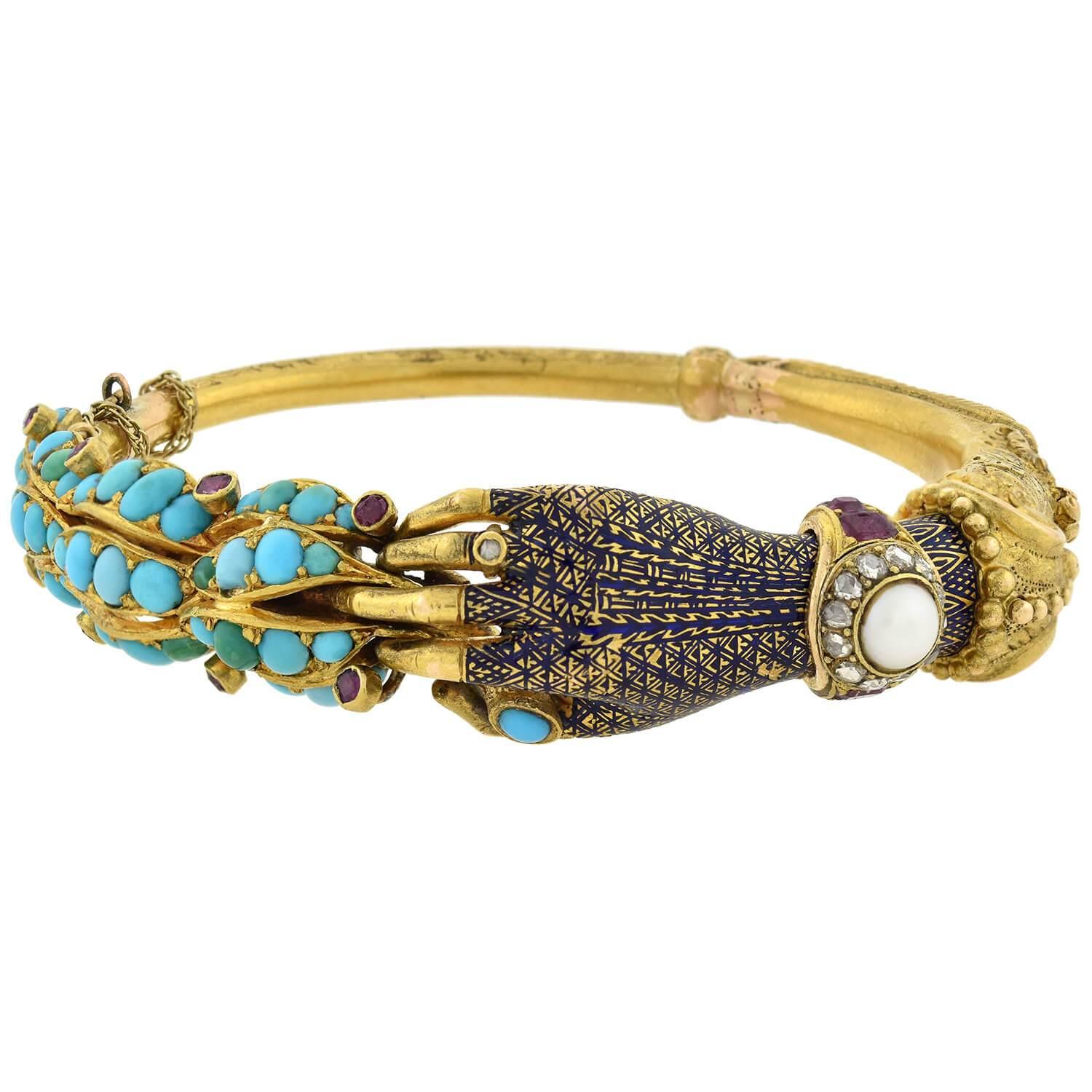 An absolutely breathtaking bracelet from the Victorian (ca1880s) era! Crafted in vibrant 18kt yellow gold, this gorgeous piece displays a 3-dimensional motif of a hand holding an elongated floral stem. The detailed, feminine hand is decorated with