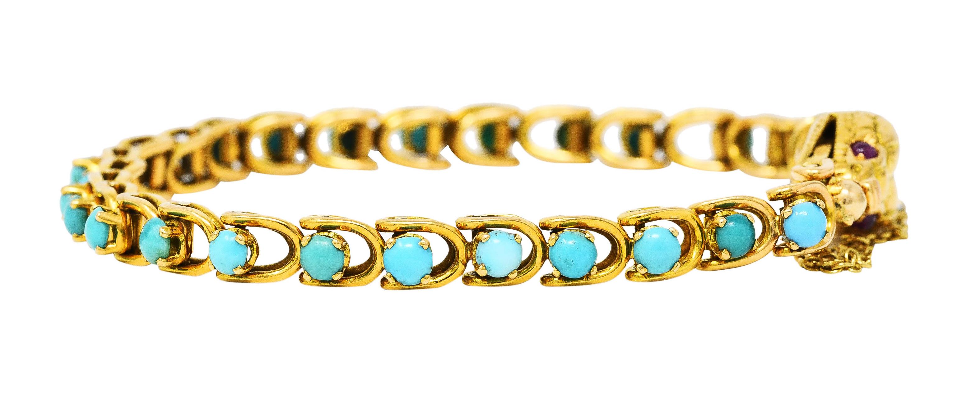 Bracelet is comprised of articulated and dimensionally folded curb links. Each set with a 3.5 mm round turquoise cabochon. Opaque and ranging from strongly bluish green to pastel blue in color. Featuring a stylized snake head with deeply engraved