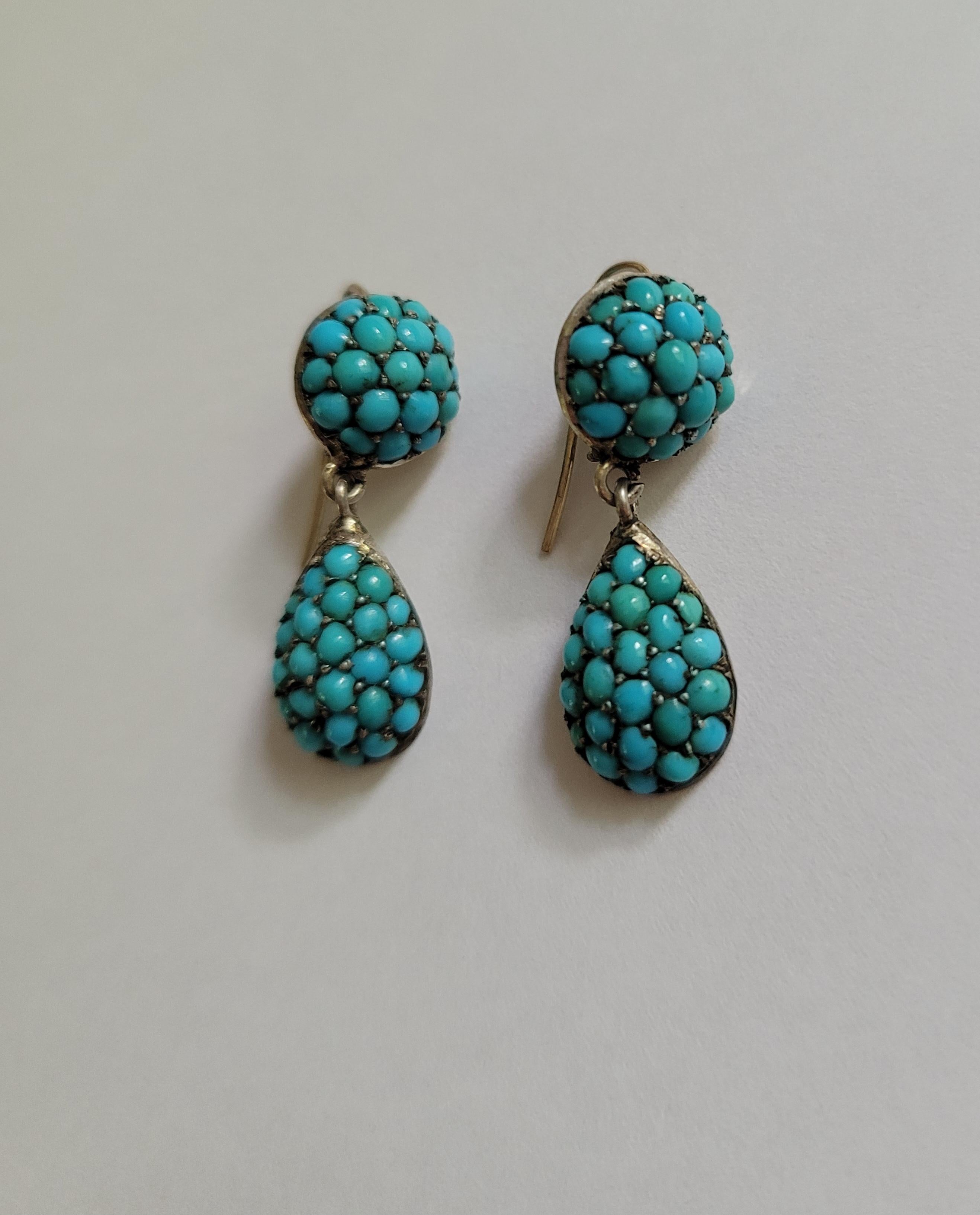 A Gorgeous Victorian Silver and Turquoise teardrop earrings. The stones in traditional Pave settings. The earrings are not heavy and perfect for everyday wear. English origin.

Total drop including hooks 27mm, 
drop without hooks 25mm,
width of the