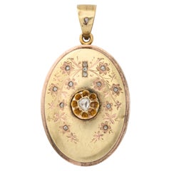 Antique Victorian Two Color Gold Locket with Rose Diamonds and Floral Engraving