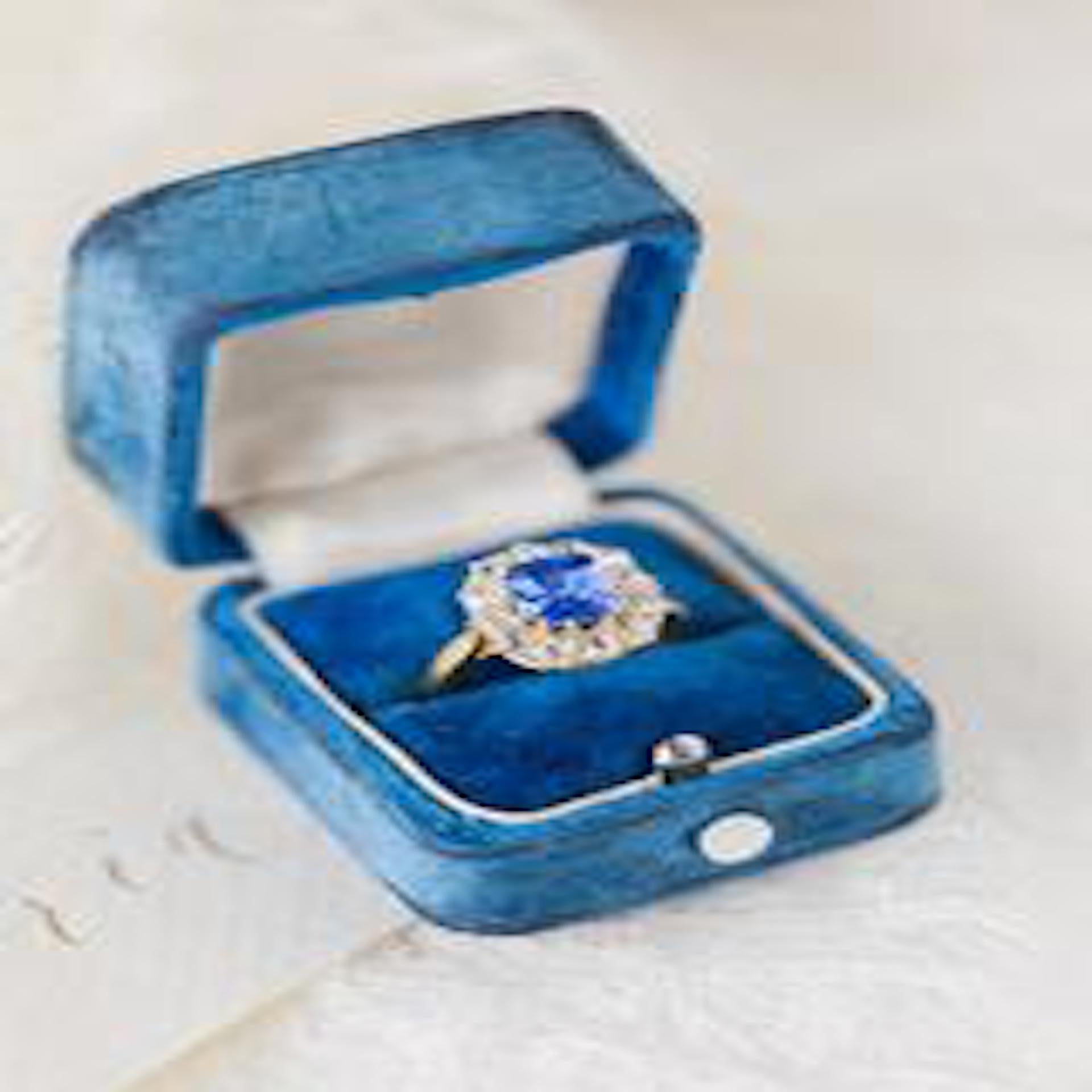 Stone Gate is a magnificent and authentic Victorian era (circa 1890) 18k yellow gold ring featuring a classic combination of gemstones. The ring centers a Cushion Cut sapphire gauged at approximately 2.33ct and accompanied by the world renowned AGL