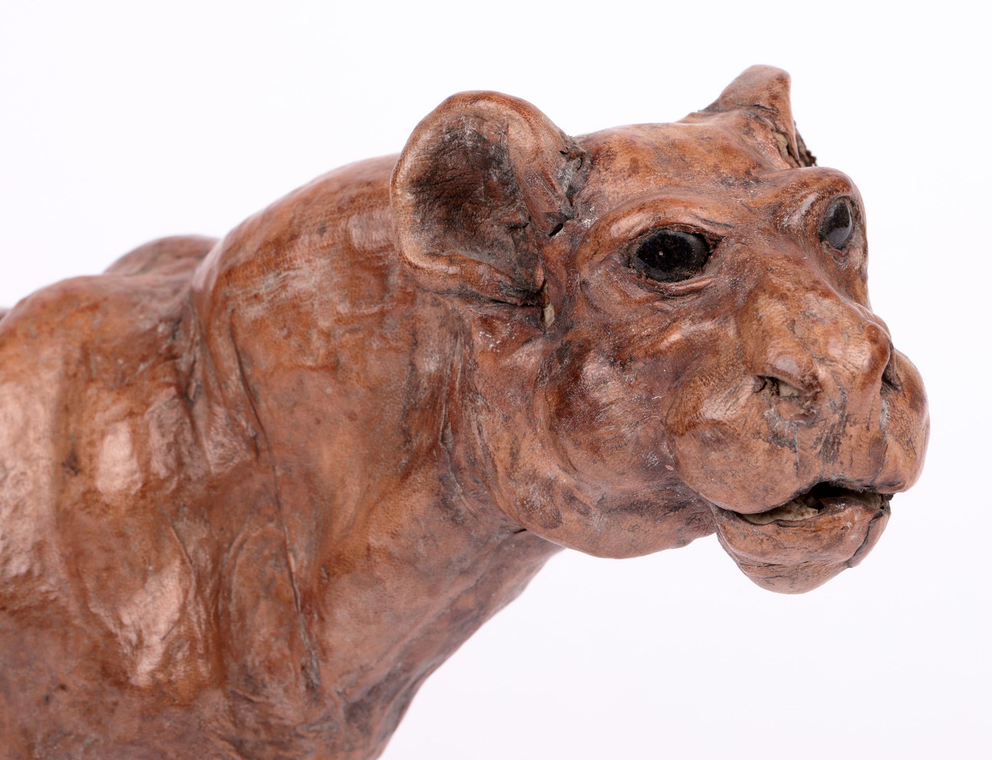 A stylish and unusual Victorian hand sculpted pressed leather figure of a lioness dating from the latter 19th century. The figure is beautifully made and portrays a prowling lioness her head held to one side. The figure is well sculpted and made in