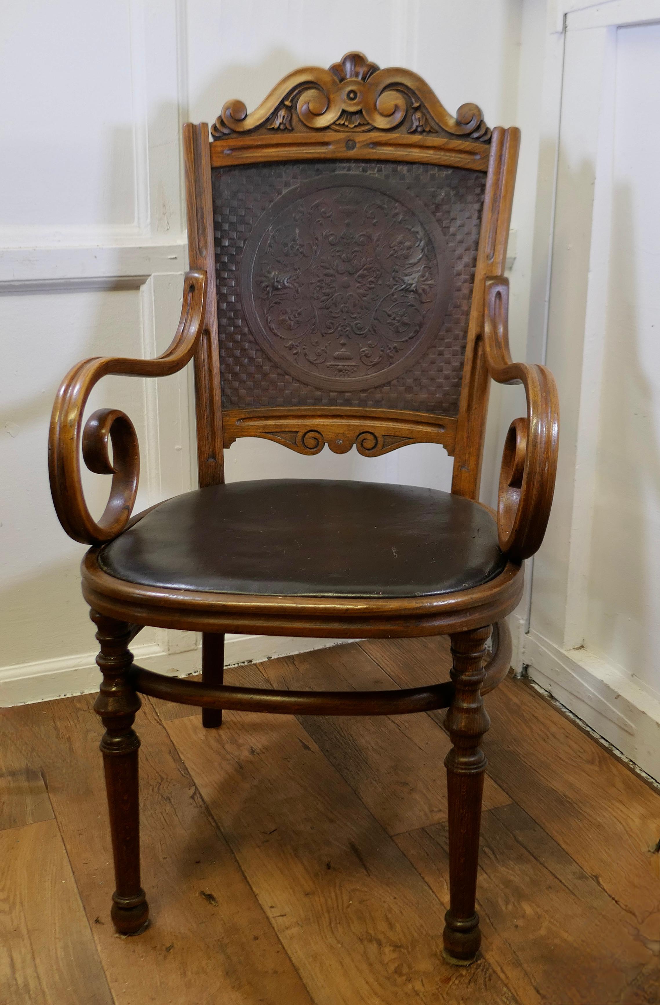 Victorian Upholstered Bentwood Salon or Desk Chair

This is a charming piece, the chair is made in the bent wood style with a carved top rail, spiral curved arms attractive turnings to the legs and leather upholstery, the back has decorative