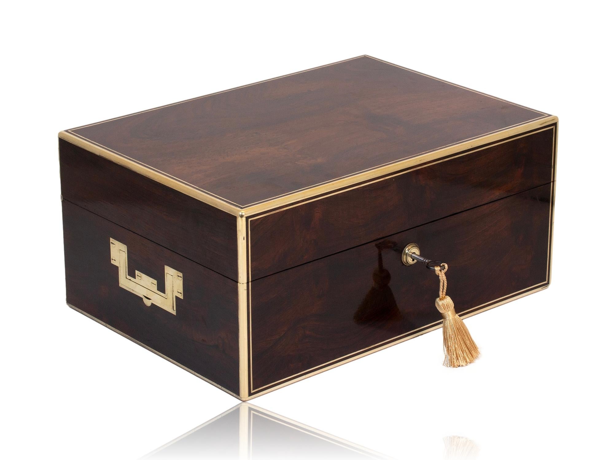 FREE WORLDWIDE SHIPPING

Sterling Silver Fittings by Thomas Douglas of London Dated 1845

From our Vanity Box collection, we are pleased to offer this Rosewood Vanity Box by David Edwards. The vanity box of rectangular form edged in brass with
