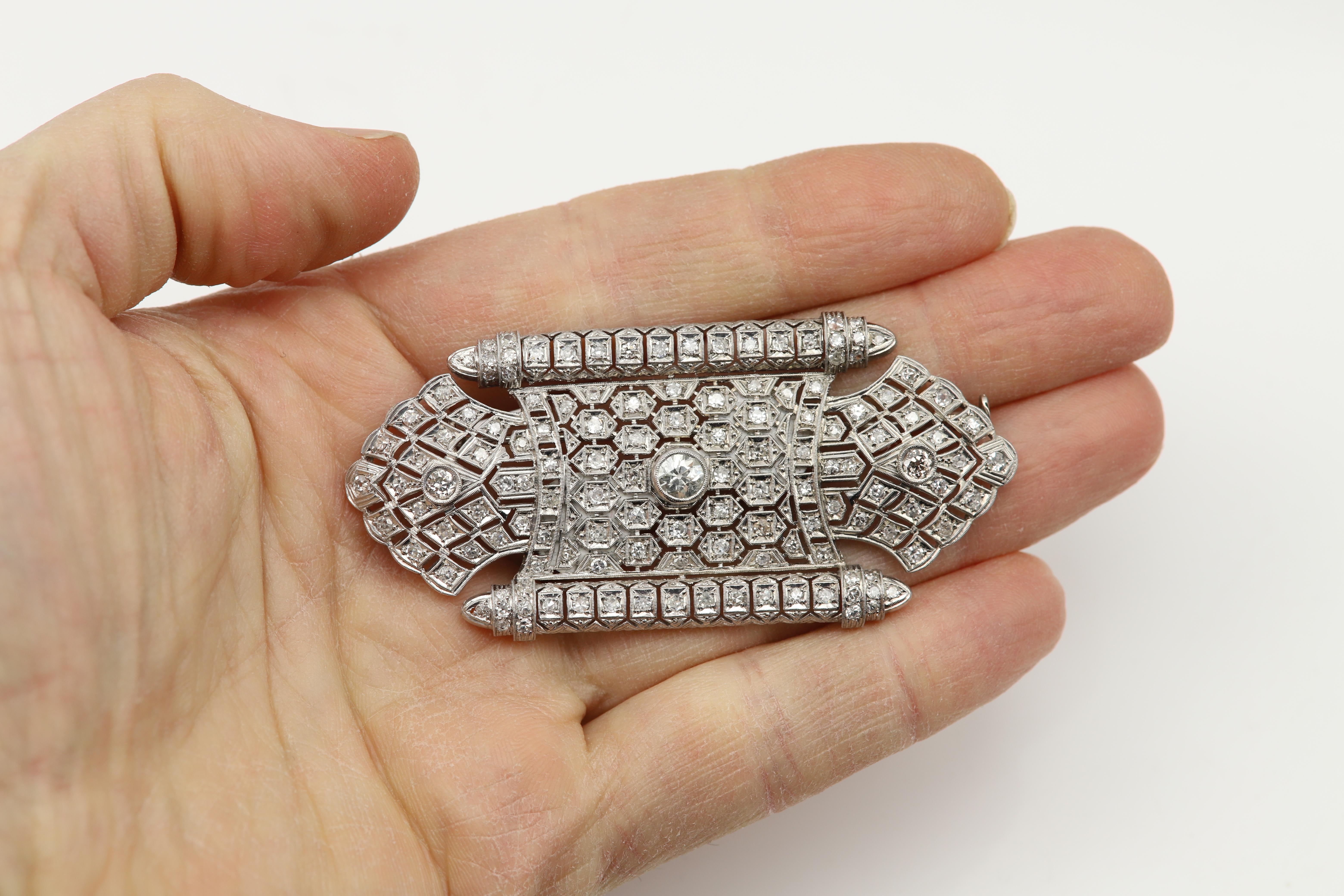 Vintage Brooch pin 
Platinum approx 28 grams
Natural Diamonds approx 6 carat 
mix sizes and qualities, center stone is 5.5mm, two others are 3.5mm the rest is approx 2.0 mm stones
mix diamonds qualities about I-H-G-SI some are old cut and single