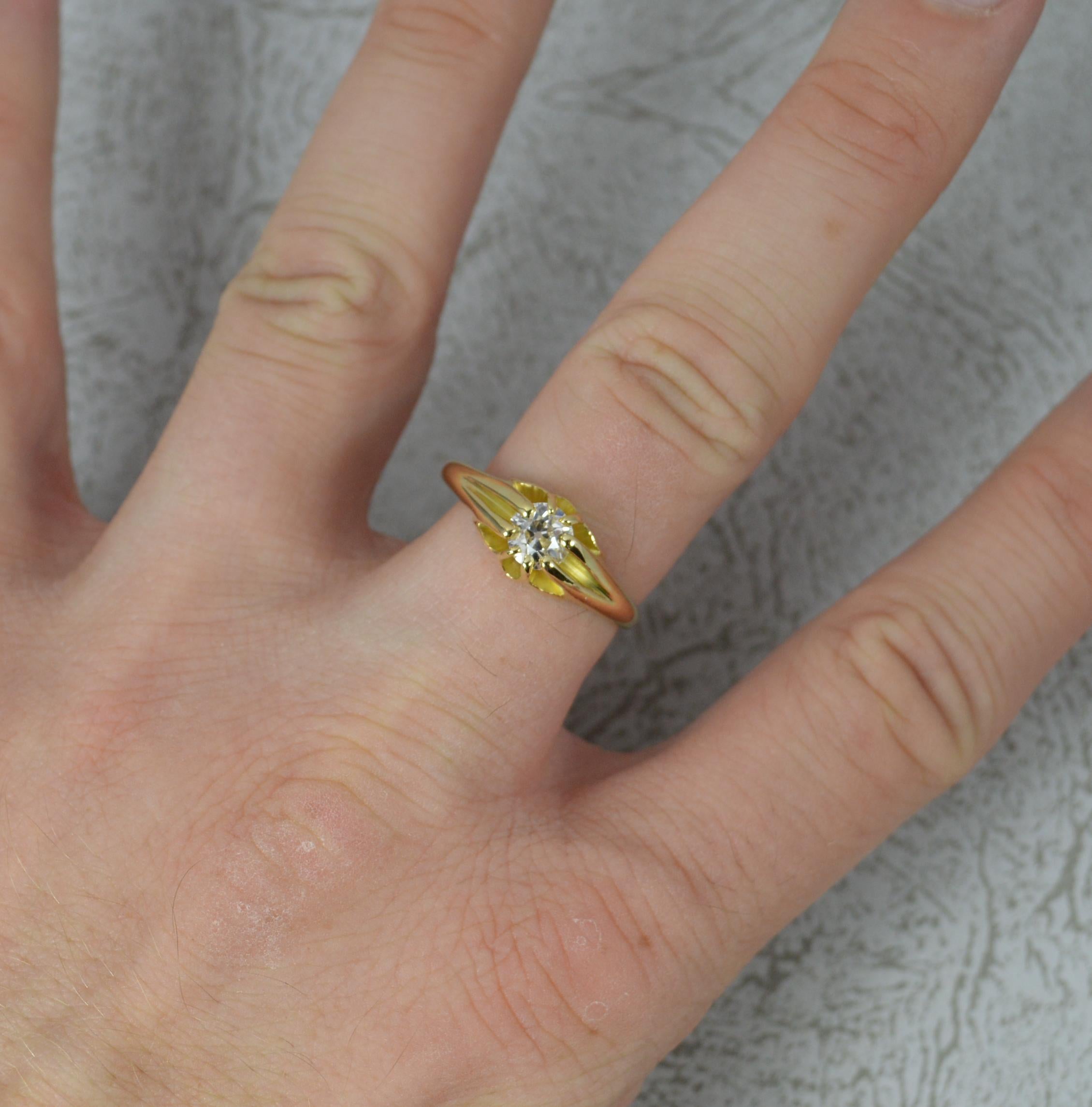 A true antique diamond and 18ct gold solitaire gypsy ring.
Solid 18 carat gold example, English made, set with a single diamond.
Eight claw setting holding the single natural, old mine cut diamond. Approx 0.75 carats. Very clean, bright and