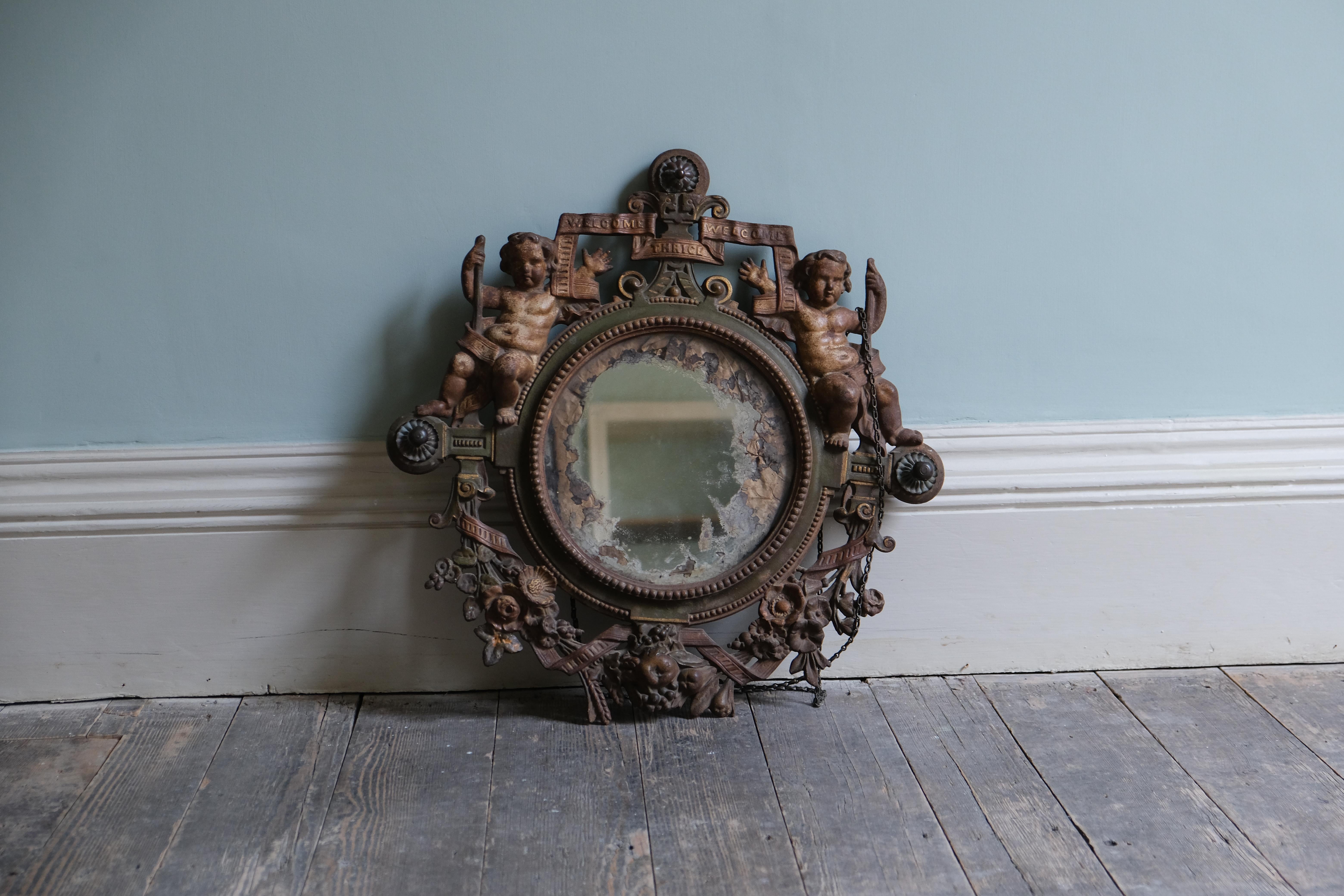English Victorian Wall Mirror Adorned with Putti For Sale