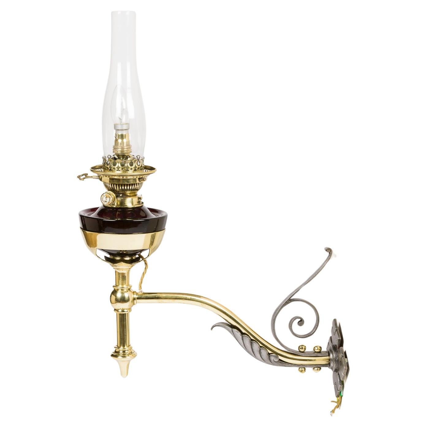 Victorian wall mounted oil lamp, converted to electricity.