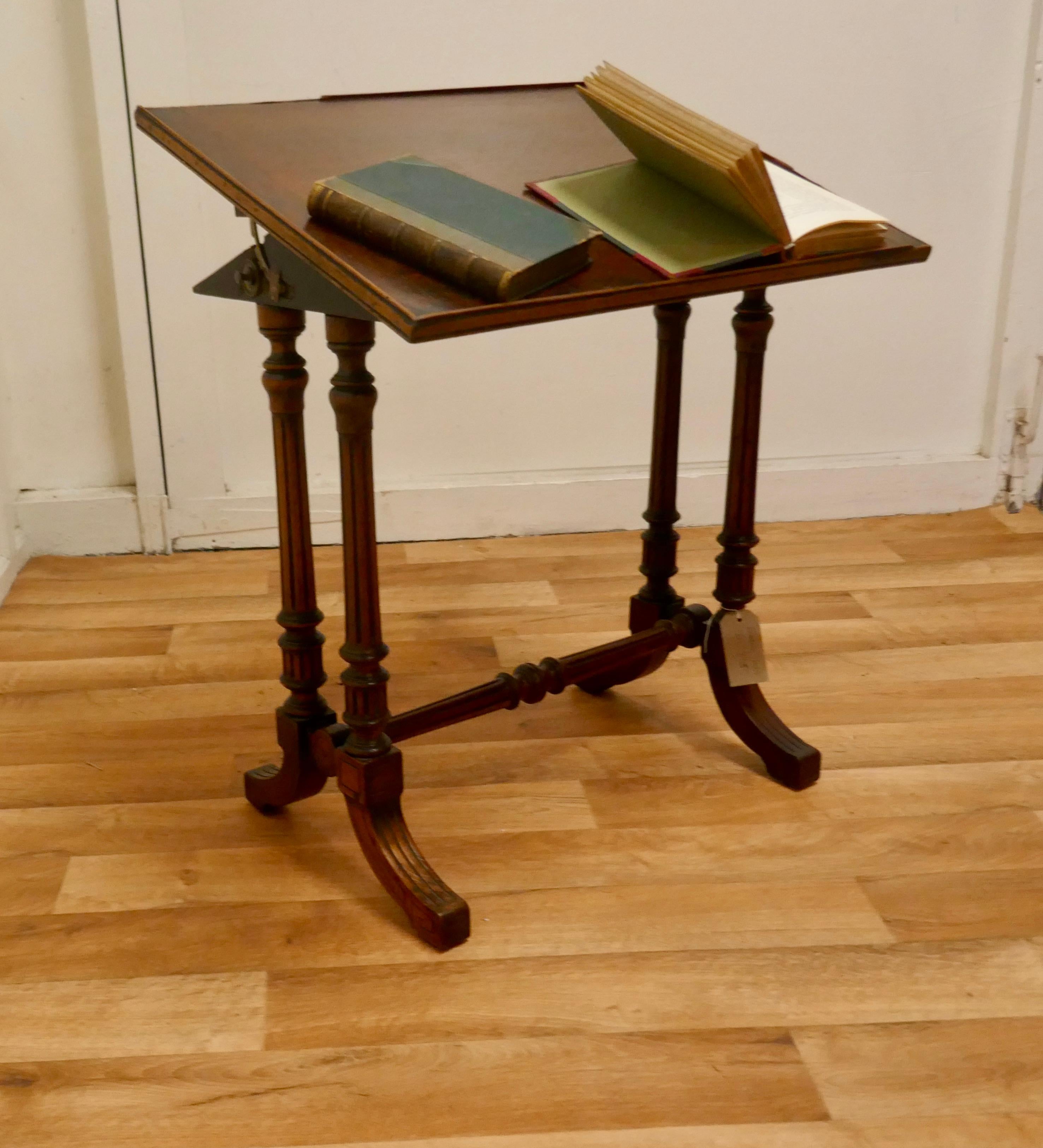 Victorian walnut adjustable reading stand 

This is a very beautiful and versatile piece, the table has an easily adjustable angle, by means of a ratchet on the side it has a small lip around the edge to hold the books in place however this has