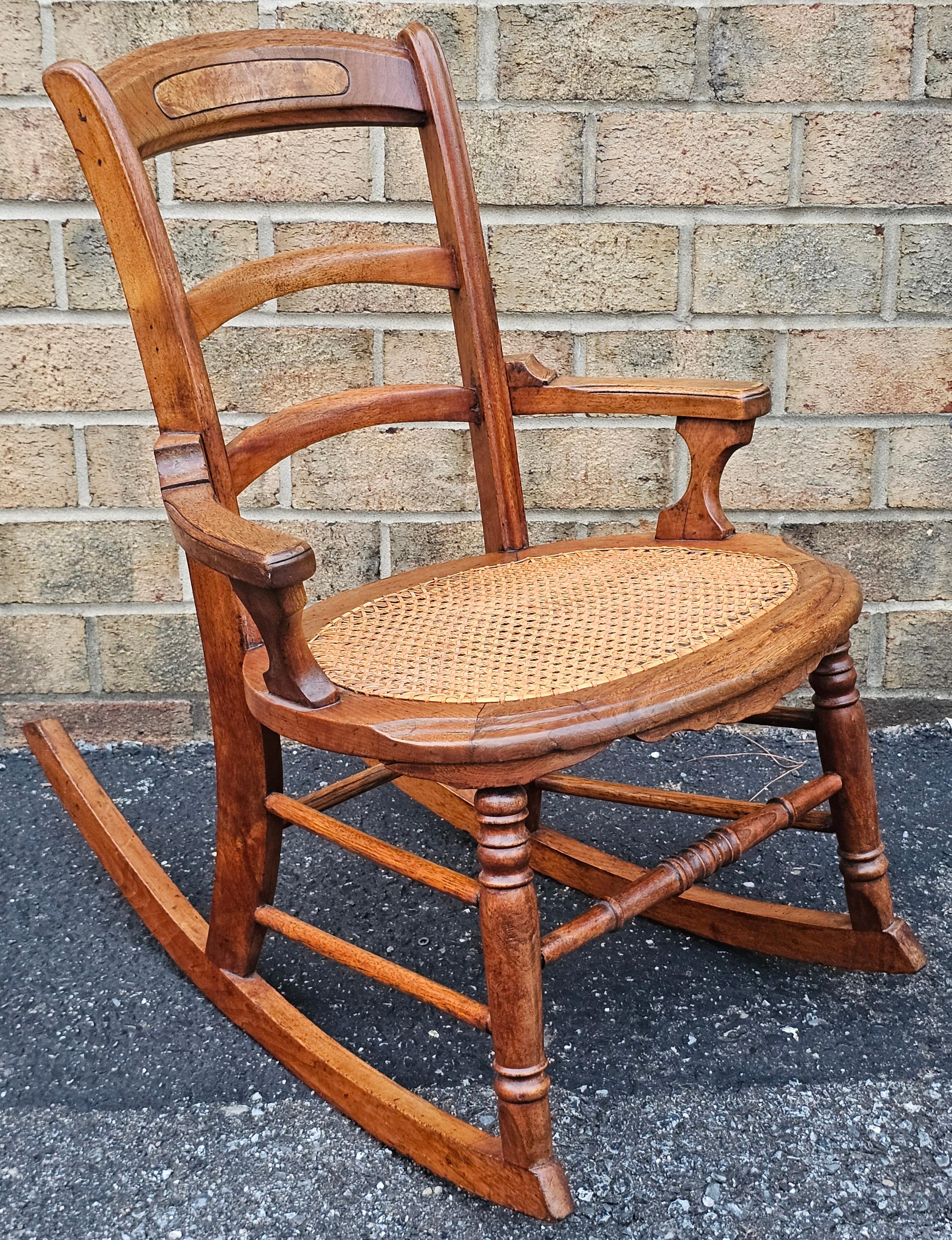 A classic Victorian stained  Walnut and Cane Seat Rocker
Measures 
18.5