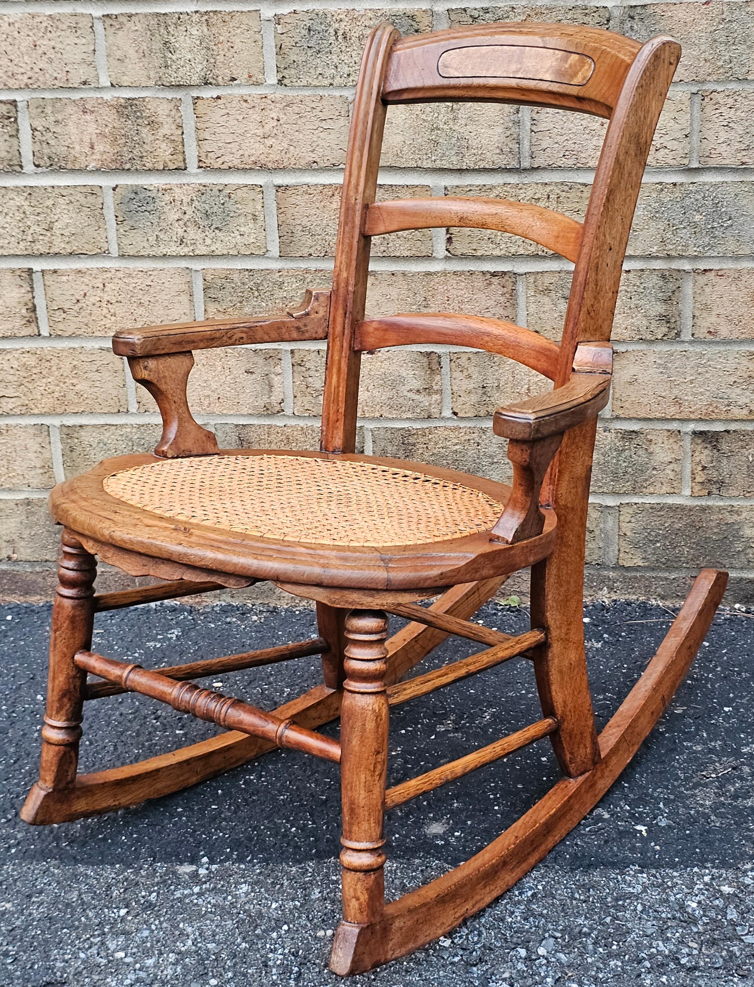 Victorian Walnut and Cane Seat Rocker In Good Condition For Sale In Germantown, MD