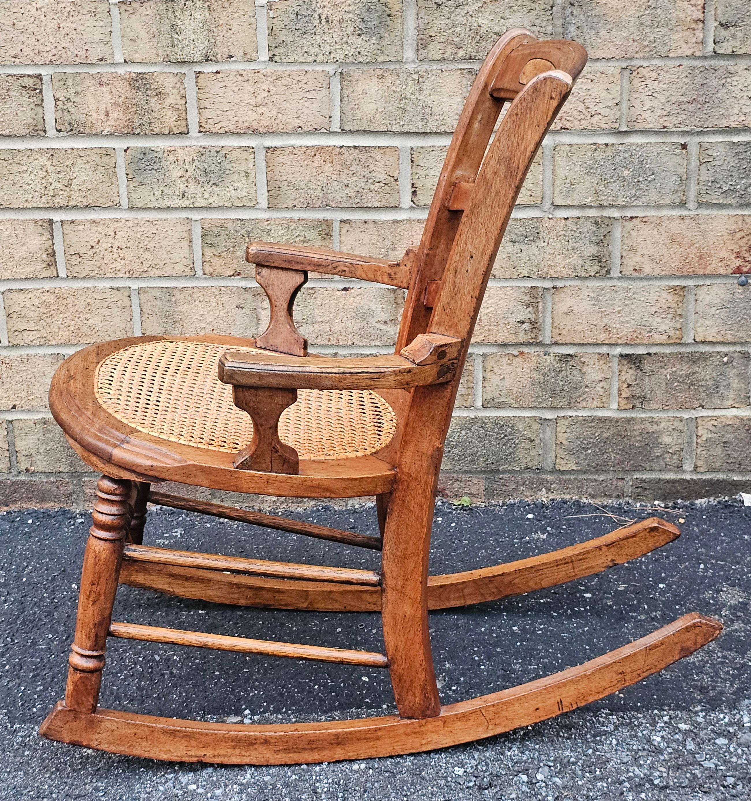 20th Century Victorian Walnut and Cane Seat Rocker For Sale