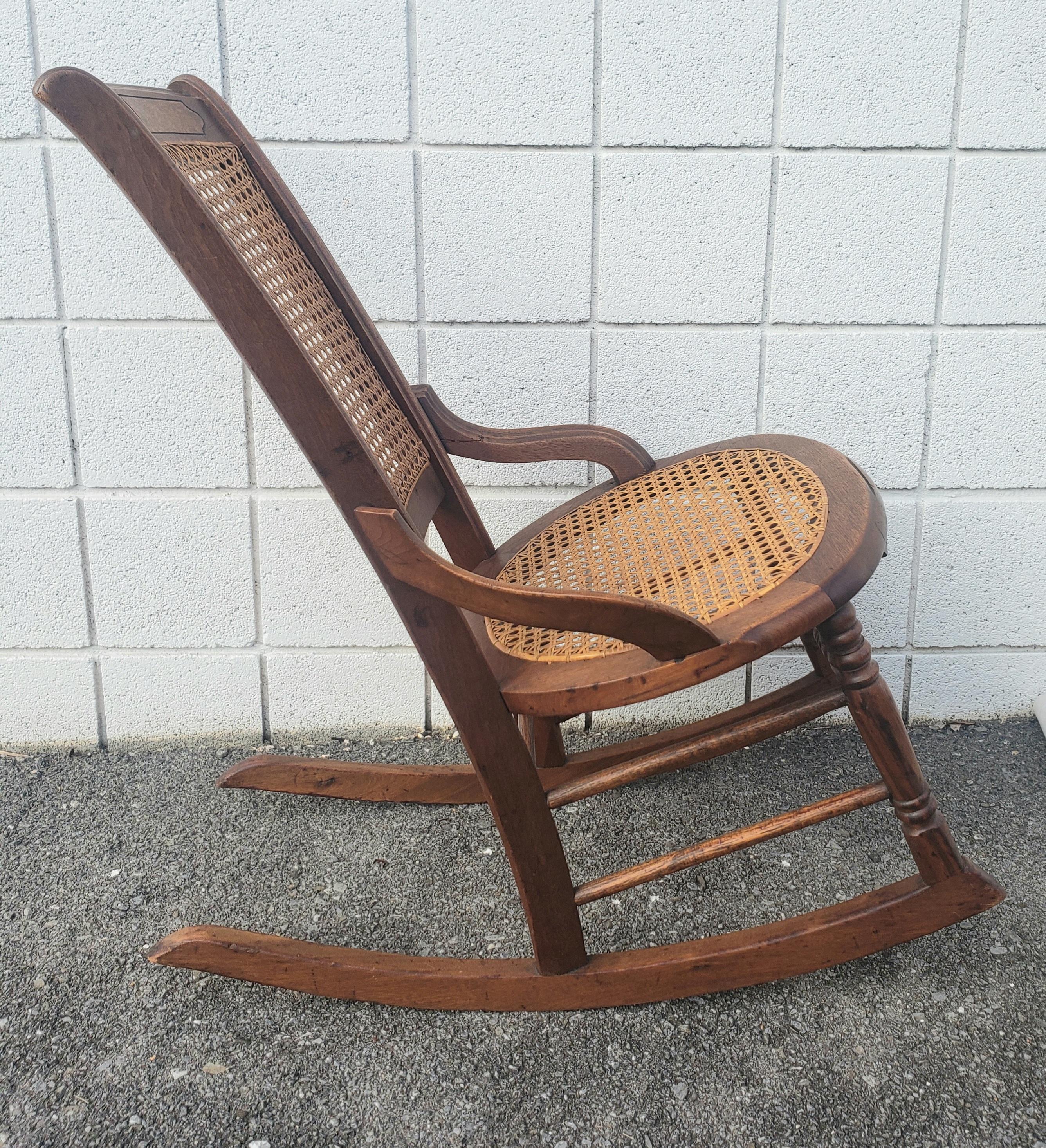 Stained Victorian Walnut and Cane Seat Rocking Chair For Sale