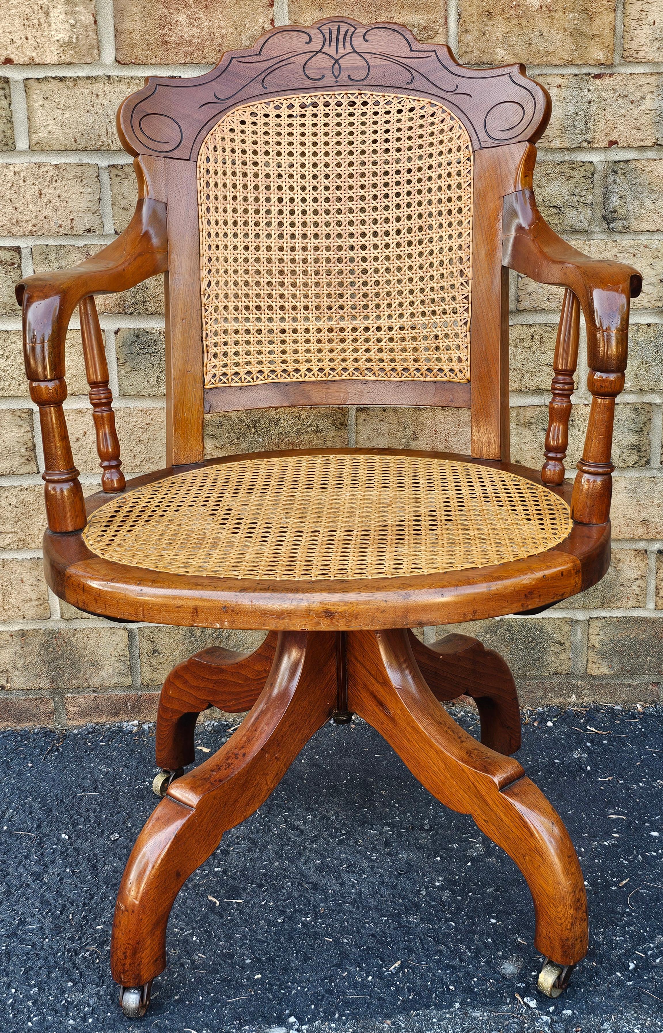 A clean Victorian Walnut and Caned Seat and Back Rolling and swivelling Office Chair.
Measures 23.85