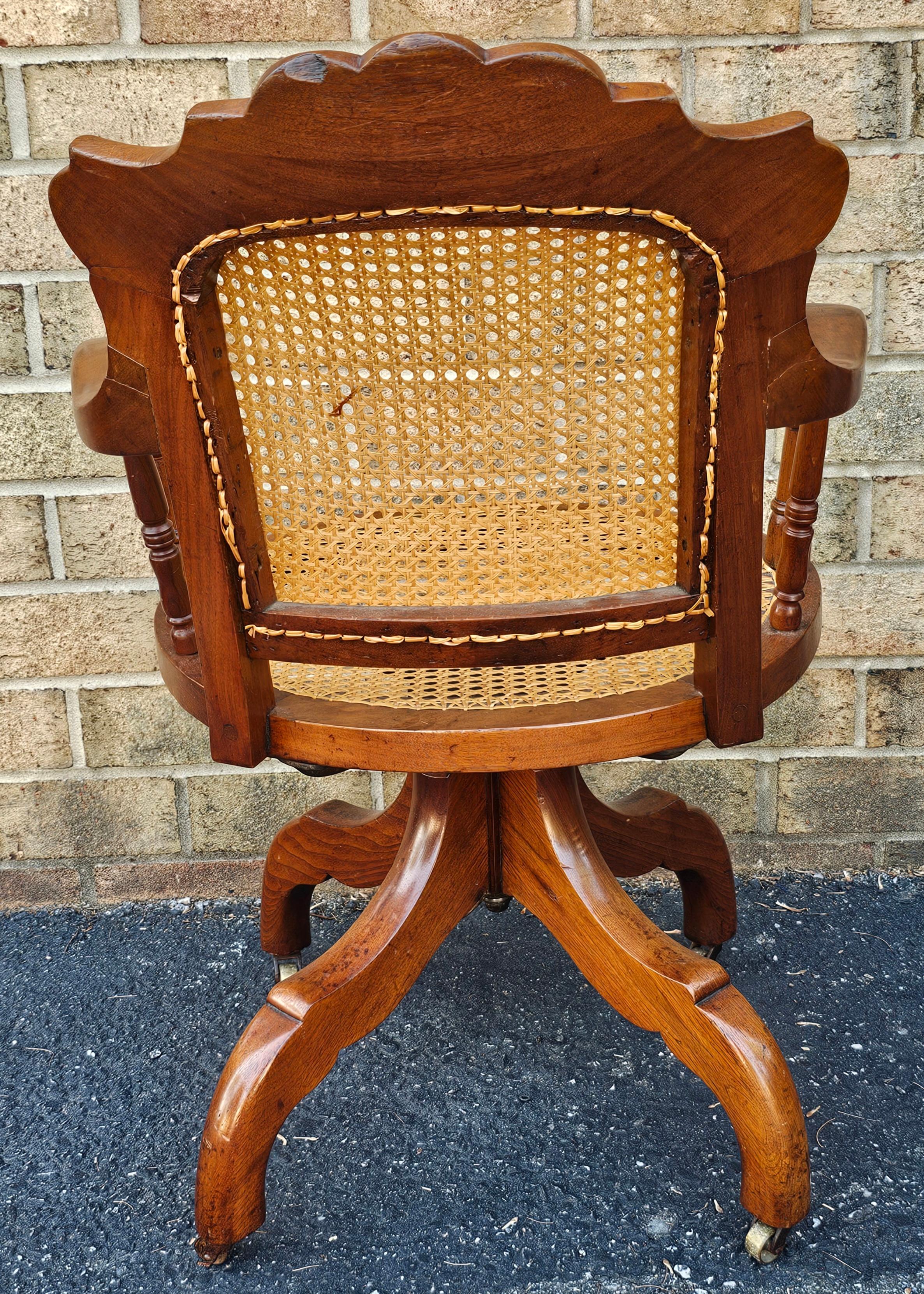 19th Century Victorian Walnut and Caned Seat and Back Rolling Office Chair For Sale