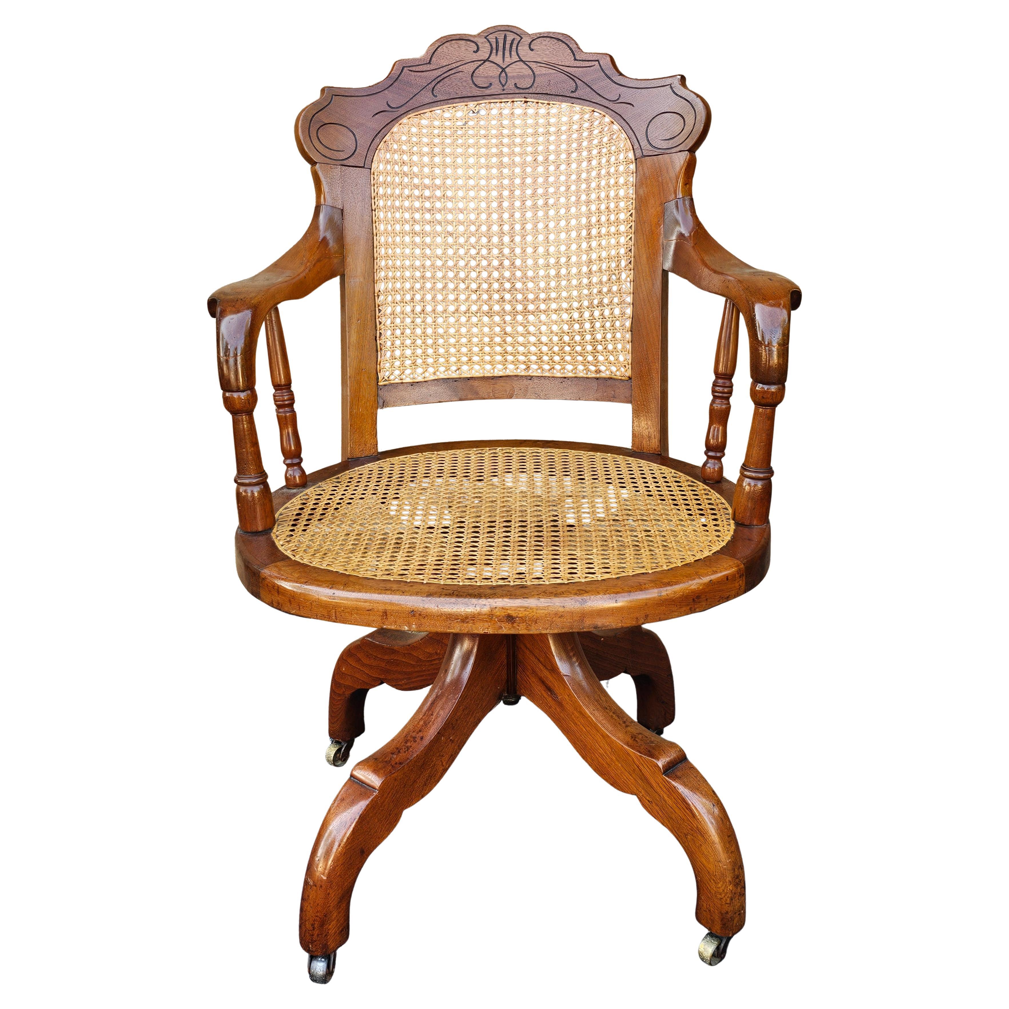 Victorian Walnut and Caned Seat and Back Rolling Office Chair For Sale