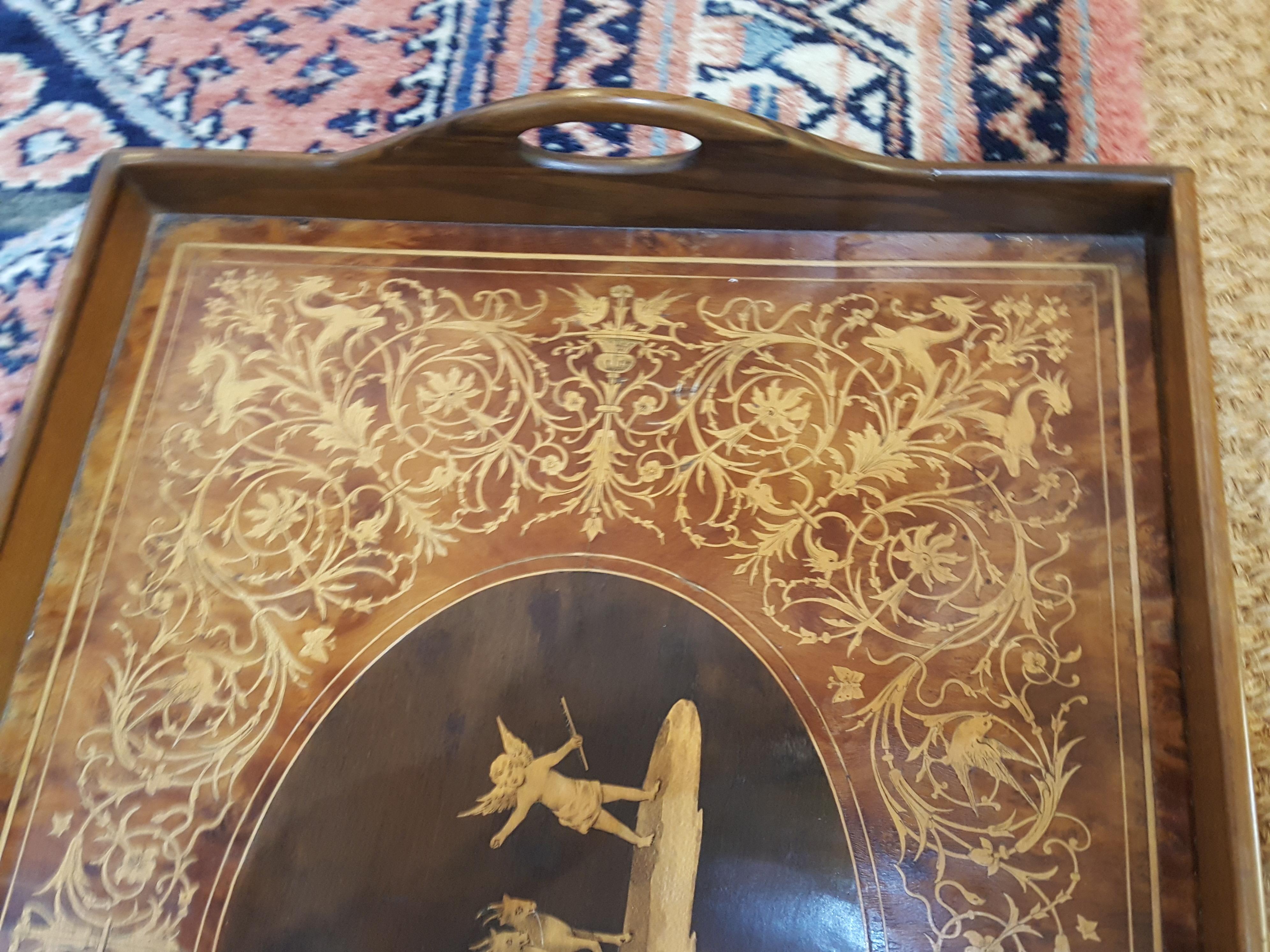 Victorian walnut tray profusely inlaid with cherubs, one in a chariot being pulled by a pair of chamois, wyverns, birds, butterflies et al 20