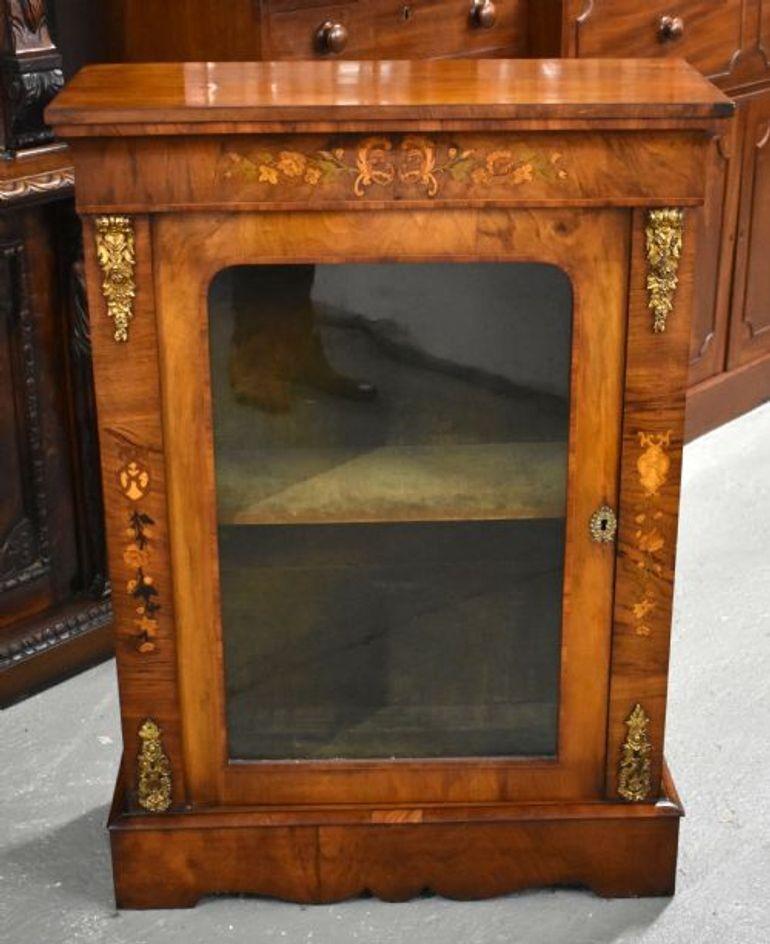 For sale is a fine quality Victorian walnut and marquetry pier cabinet, in good condition for its age, showing minor signs of wear commensurate with age and use.

Width: 30