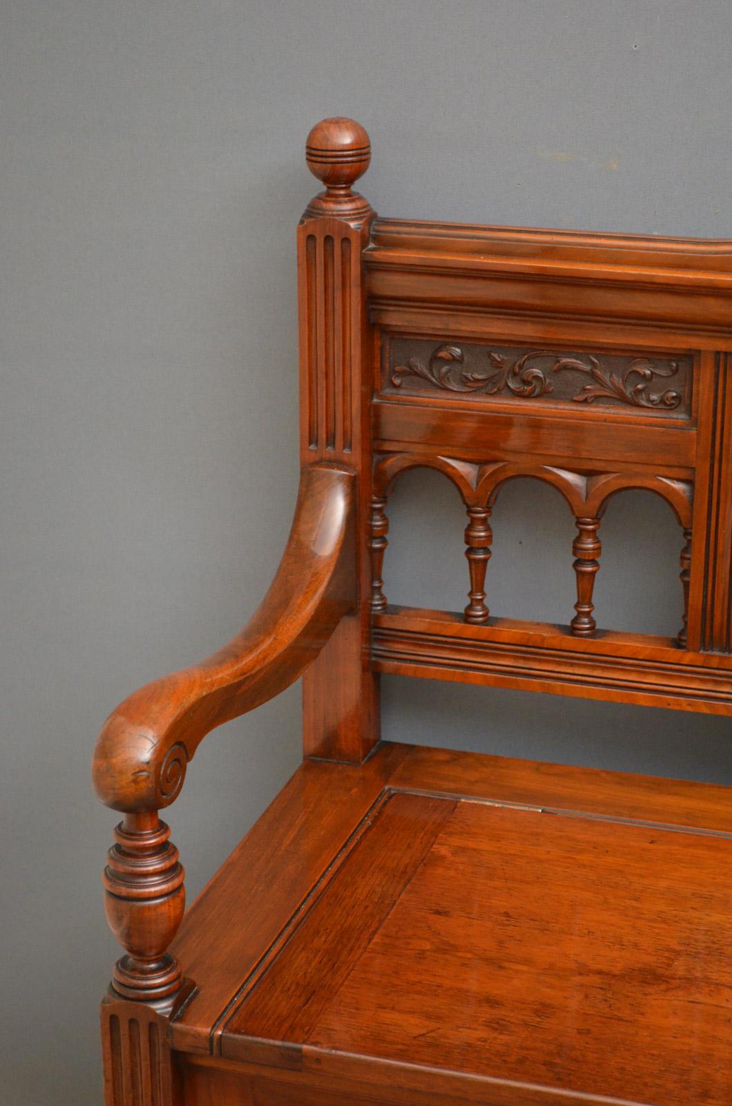 Sn4503 Stylish Victorian walnut hall bench, having carved back flanked by spindles, lift up seat with storage compartment flanked by open scroll arms and panelled base. This antique hall bench is in excellent original condition throughout, circa