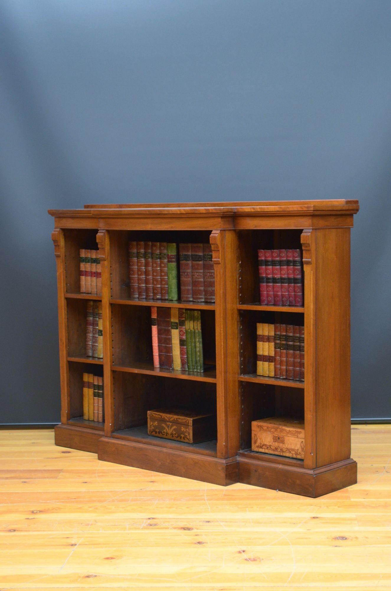 Sn5415 Victorian walnut open bookcase of break fronted design, having figured walnut top with small gallery, please see photo, above a projecting open section with two height adjustable shelves flanked by further open sections with height adjustable