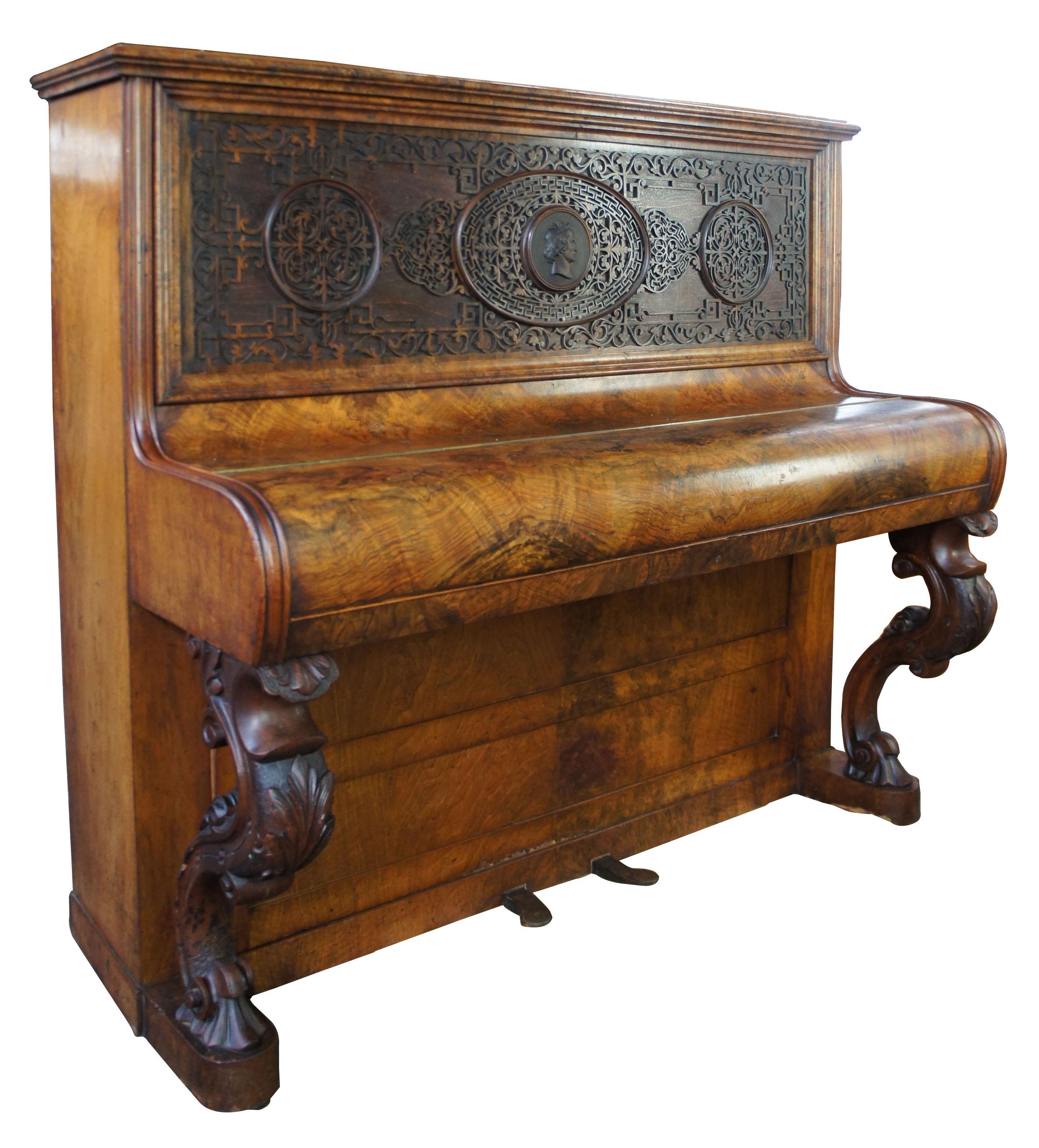 Victorian walnut burr upright piano Beethoven Medallion Fretwork James Dace, 1890

A gorgeous Victorian upright piano. Features a walnut burr case and ornate fretwork front panel with a Beethoven carved medallion along the center. Legs are