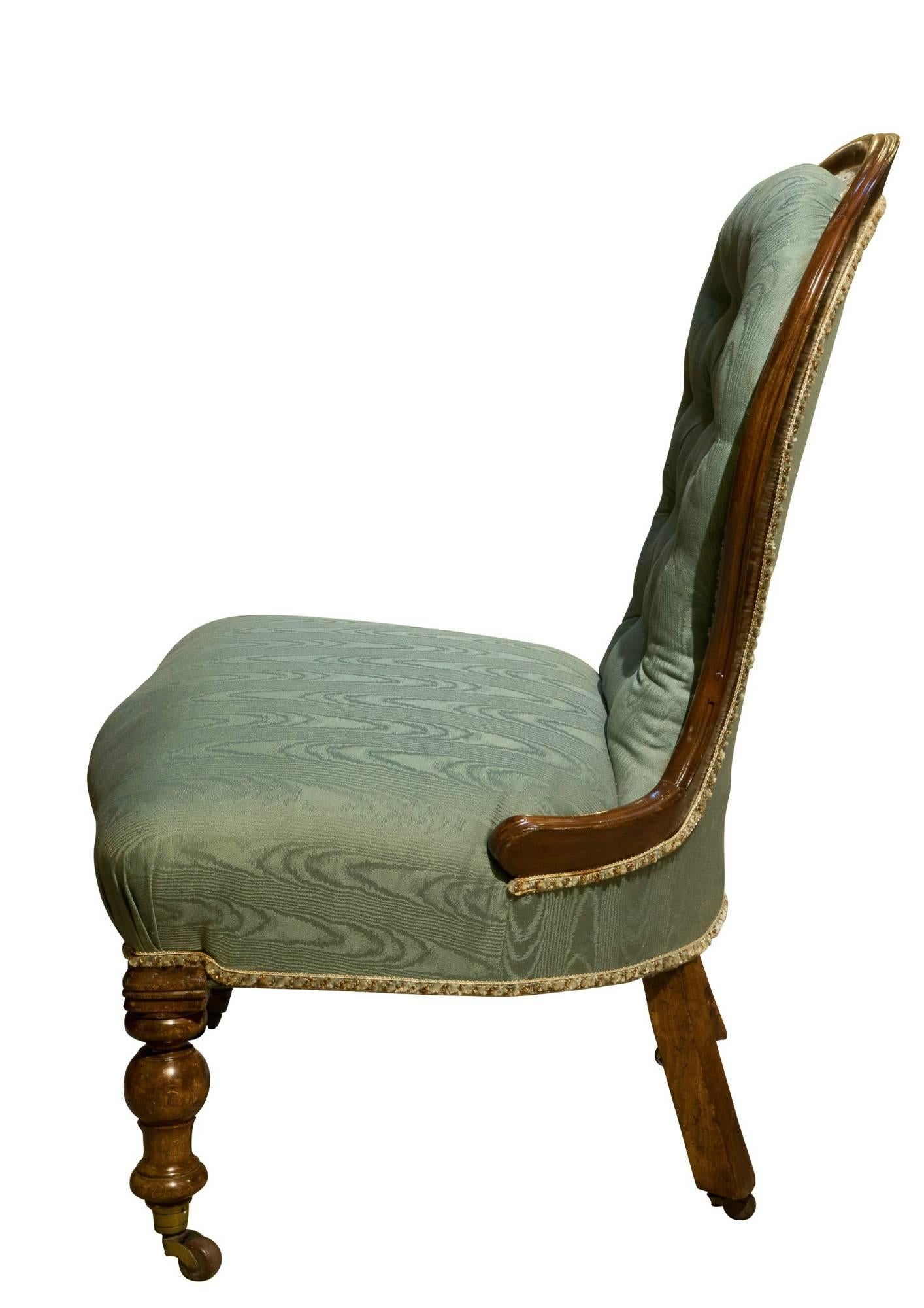 A pretty Victorian walnut button back bedroom chair later upholstered in silk,

circa 1880.
 