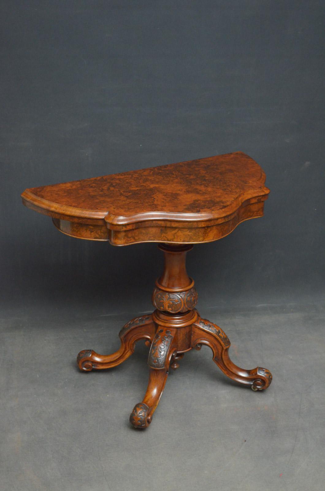 M00 attractive Victorian card table in burr walnut, having shaped, fold over top enclosing green baize games surface, standing on carved vase shaped column terminating in 4 downswept carved legs and castors.
This antique games table would make a