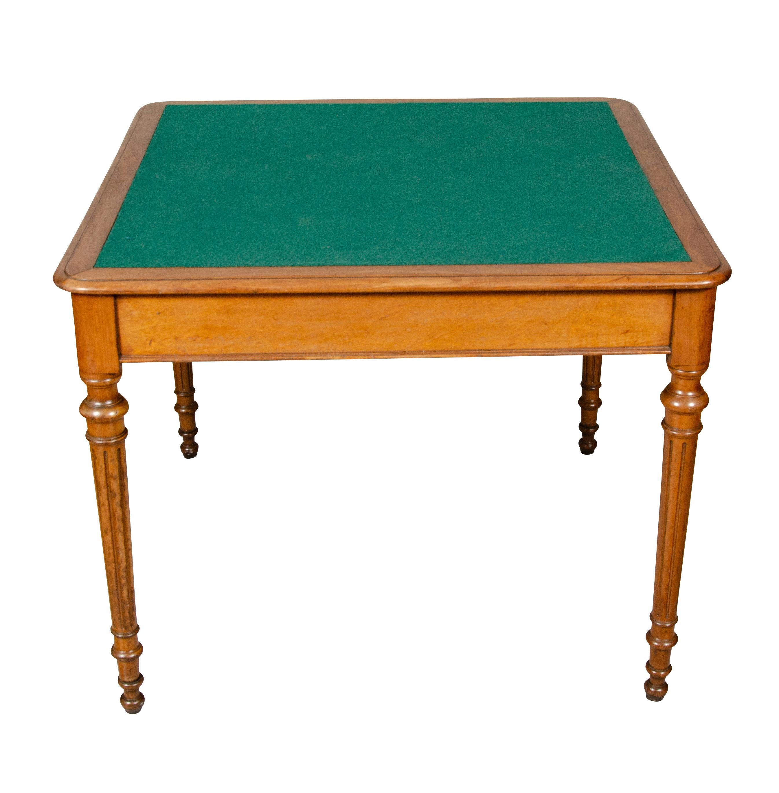 Square with green baize surface with wood borders, plain frieze and raised on circular fluted legs. Purchased by me in Montecito Ca.