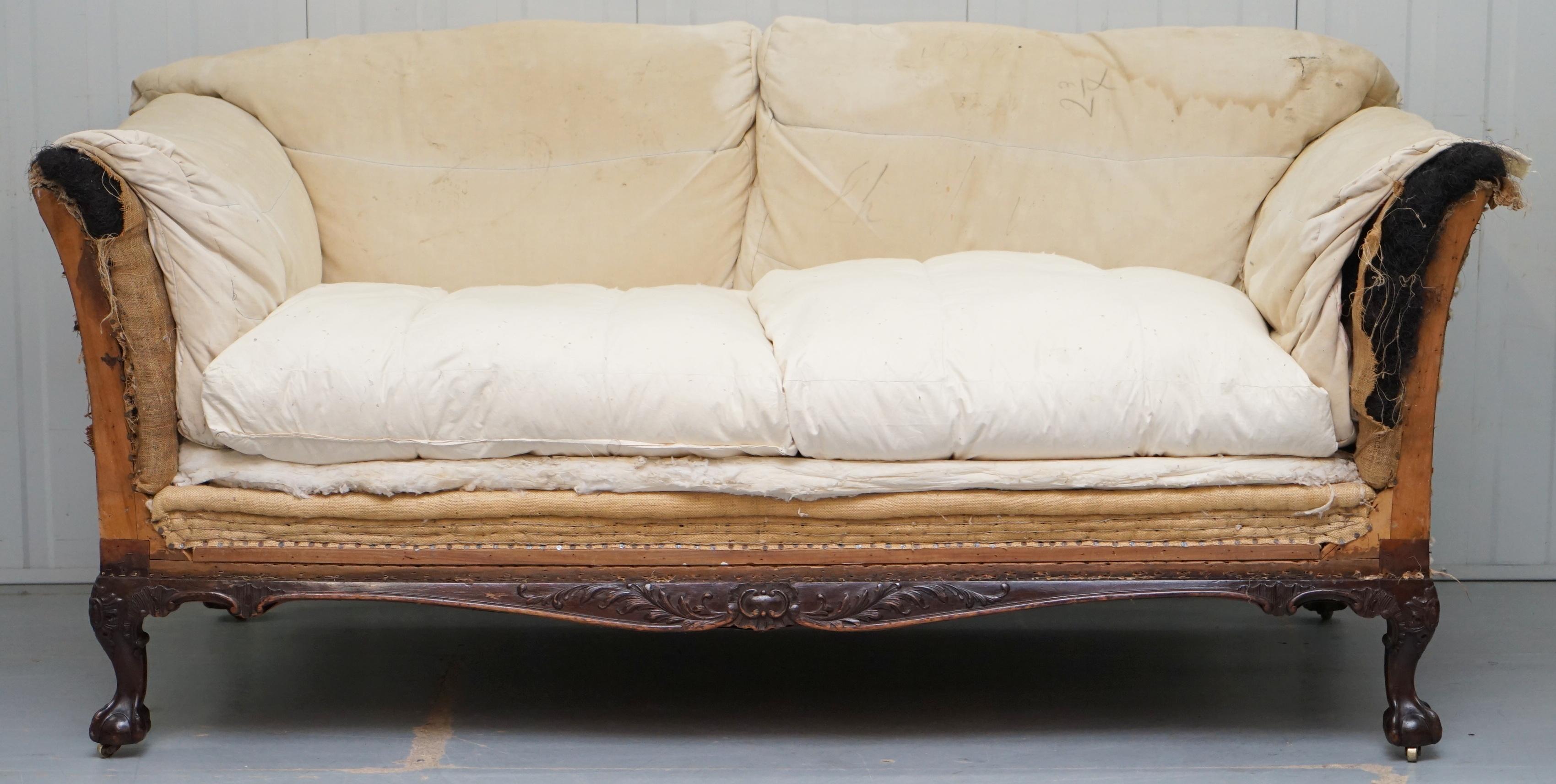 We are delighted to offer for sale this stunning exceptionally rare original Victorian walnut framed claw and ball feet Howard & Son’s Berners Street stamped sofa with the original feather filled cushions and horse hair filling

This sofa is