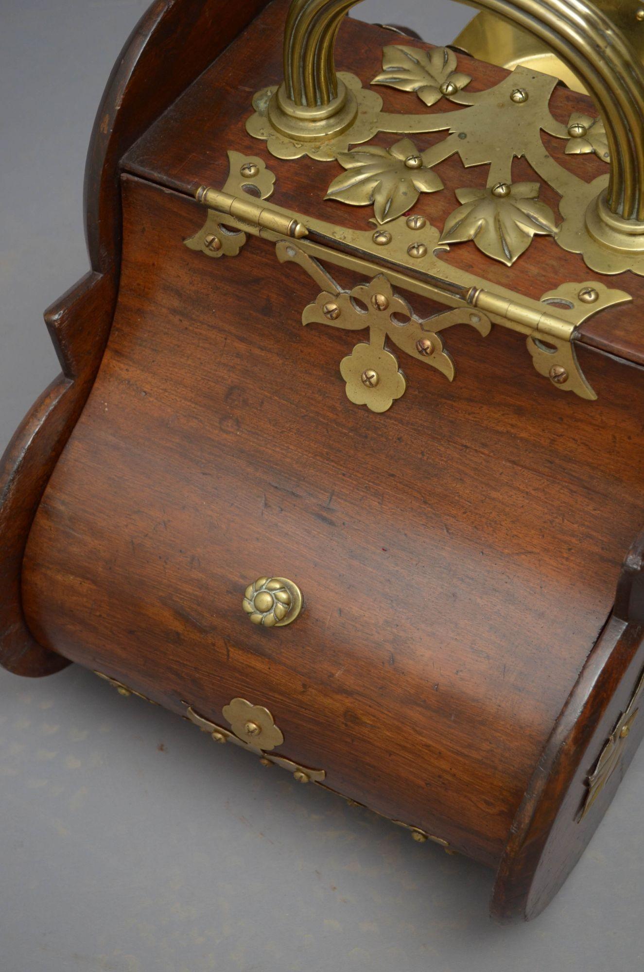 Sn4932 Victorian walnut coal bin with brass carry handle, a shovel and original liner, all with decorative brasses throughout and date lozenge. This antique coal scuttle bears some signs of usage. Ready to place at home. c1880
H18