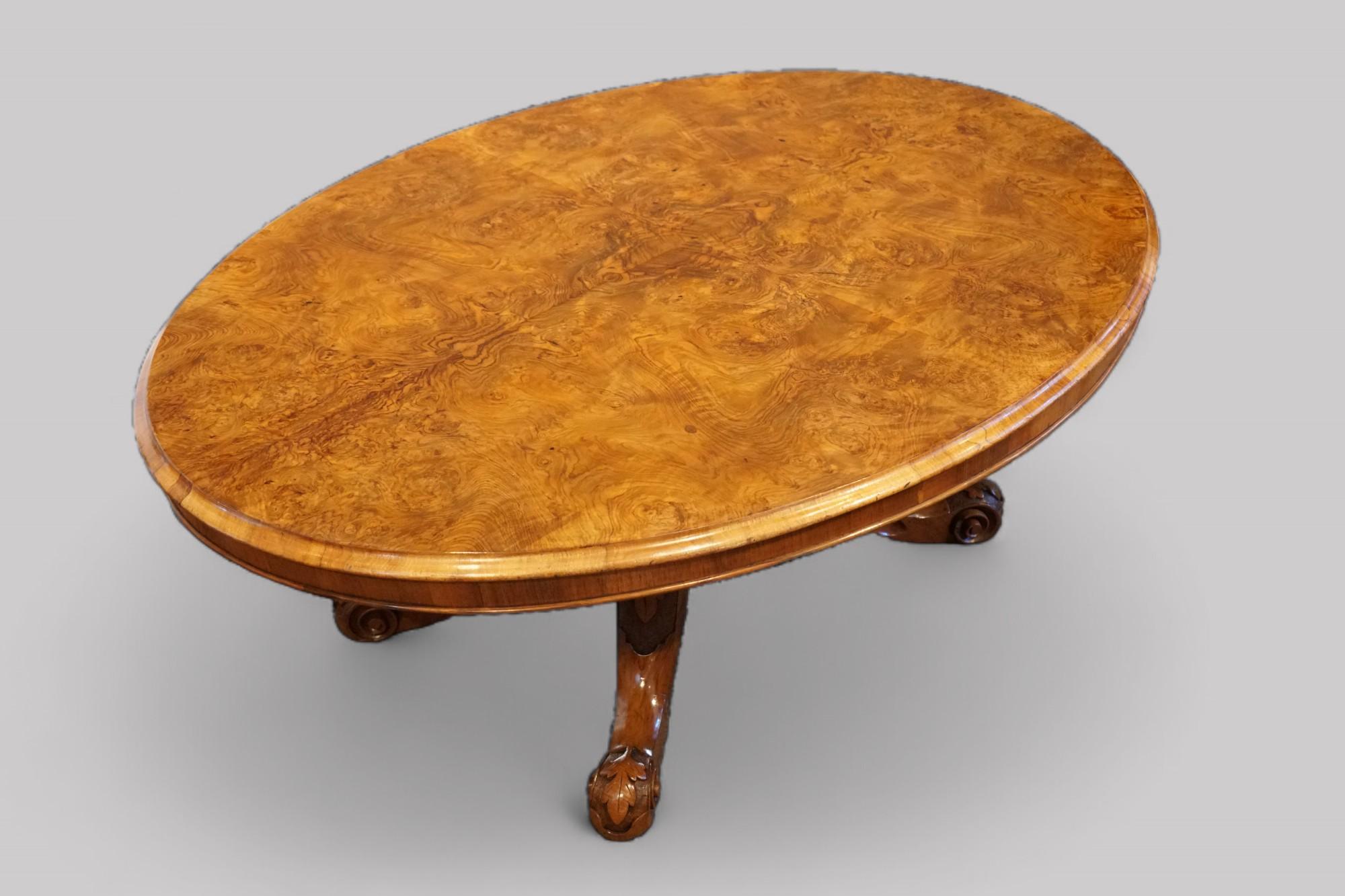 Victorian burr walnut coffee table 
This Victorian walnut coffee table was made circa 1865. 
Of oval shape this Victorian walnut coffee table stands on the solid walnut base, with carved legs and feet.
The cabinetmaker would have taken time