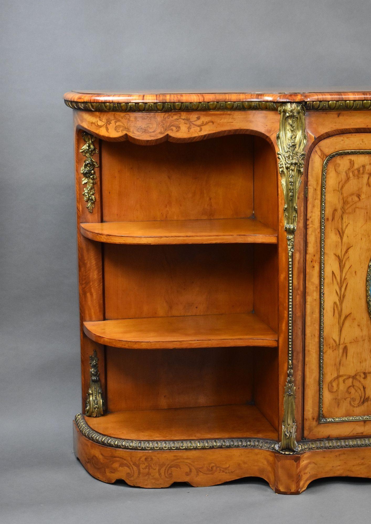 Antique Victorian burr walnut Credenza with open ends enclosing two shelves with two centre cupboards with sevres plaques on each enclosing two shelves. The credenza has decorative quality ormolu brass mounts on each corner and decorative brass to