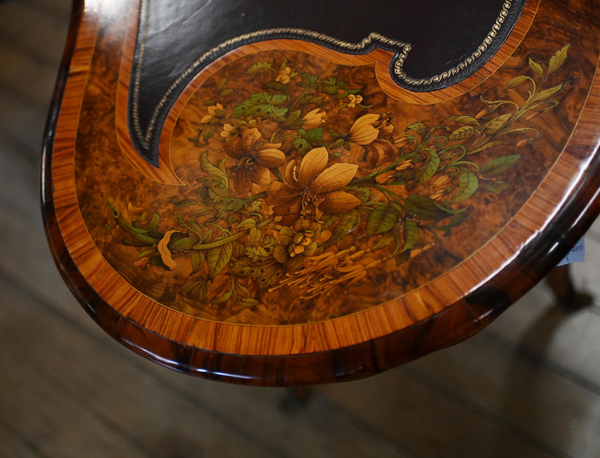 You are viewing an exquisite Victorian desk of kidney bean form
Table is crafted from burr walnut and the patina is sumptuous
Great writing table and we date this to circa 1880
Ormolu fixtures are original 
Intricate floral inlay is exceptional made