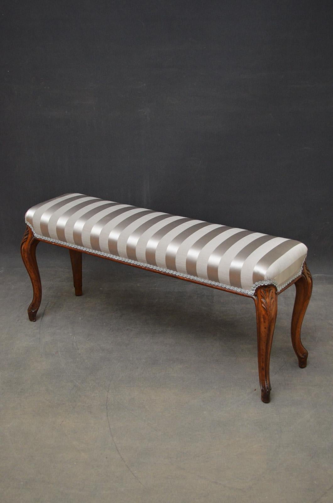 Sn4534, an attractive Victorian window seat in walnut, having rectangular seat recovered in silver / grey fabric and standing on cabriole legs united by moulded frame. This antique stool is in excellent condition throughout, ready to place at home,