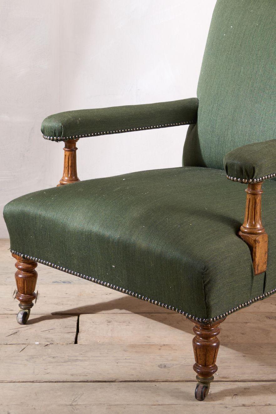 This is a great looking 19th century Victorian period open armchair. The frame is walnut and has elegant carved details. There is an old repair to the back leg but done well and hardly noticeable. The size of this chair is very neat and will work