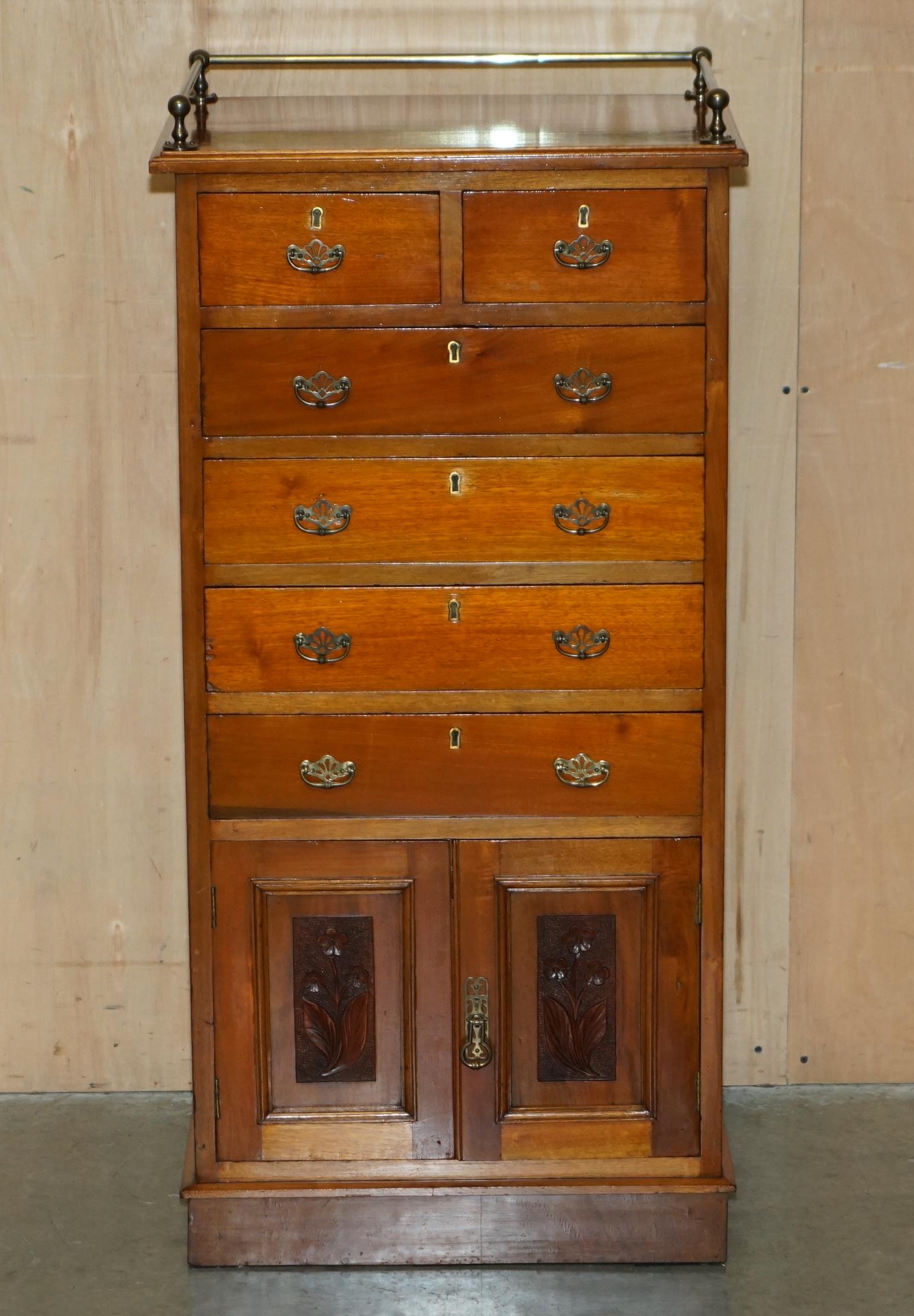 Royal House Antiques

Royal House Antiques is delighted to offer for sale this stunning Victorian Arts & Crafts circa 1860-1880 hand made in England tallboy chest of drawers with cupboard base and bronzed gallery rail

Please note the delivery fee