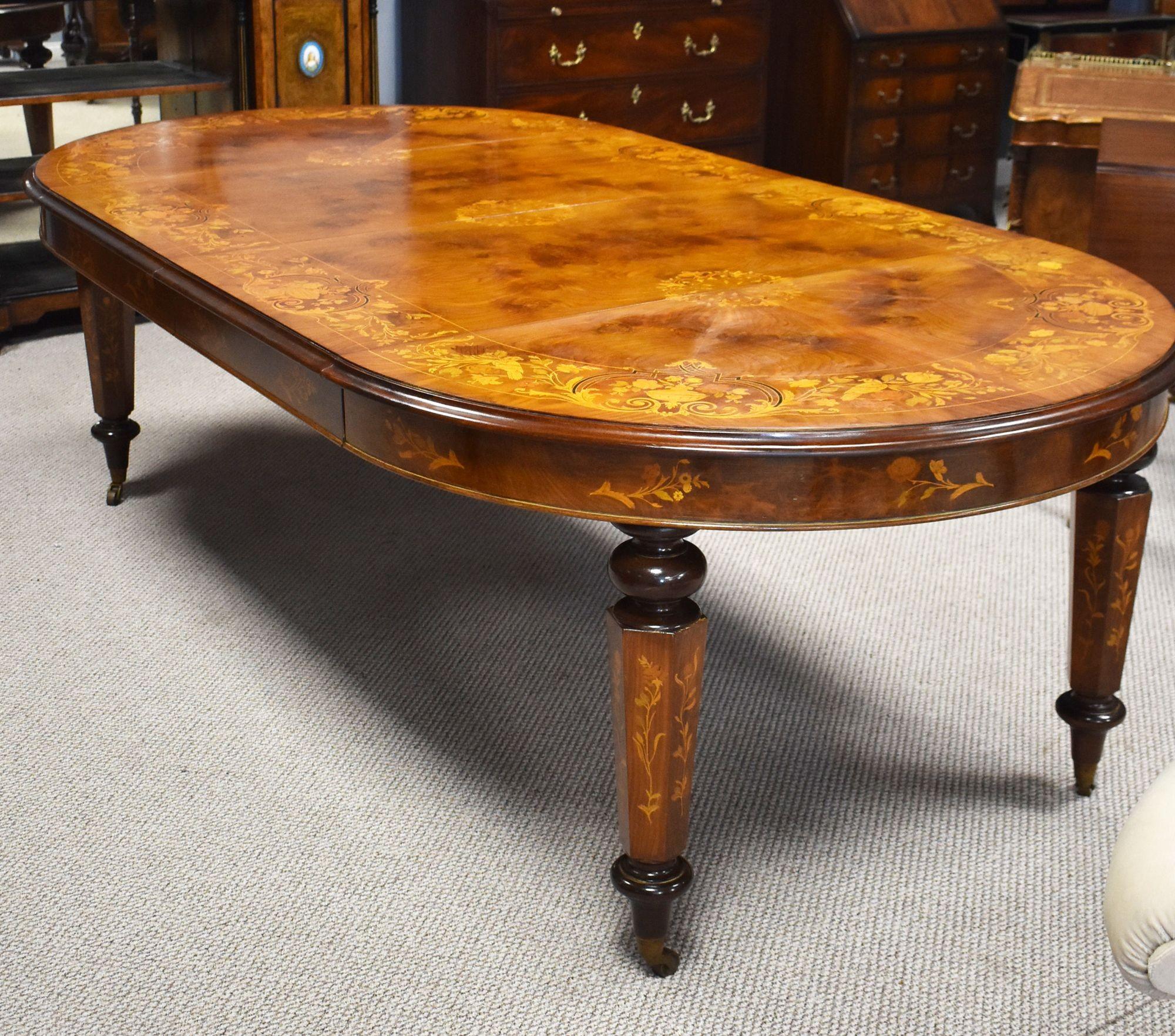 Victorian Walnut inlaid extending windout dining table, the top inlaid with stringings,floral urns,birds and scroll marquetry. The table has a moulded edge on a turned hexagonal supports with castors.
Dimensions
Width 250cm extended 130cm