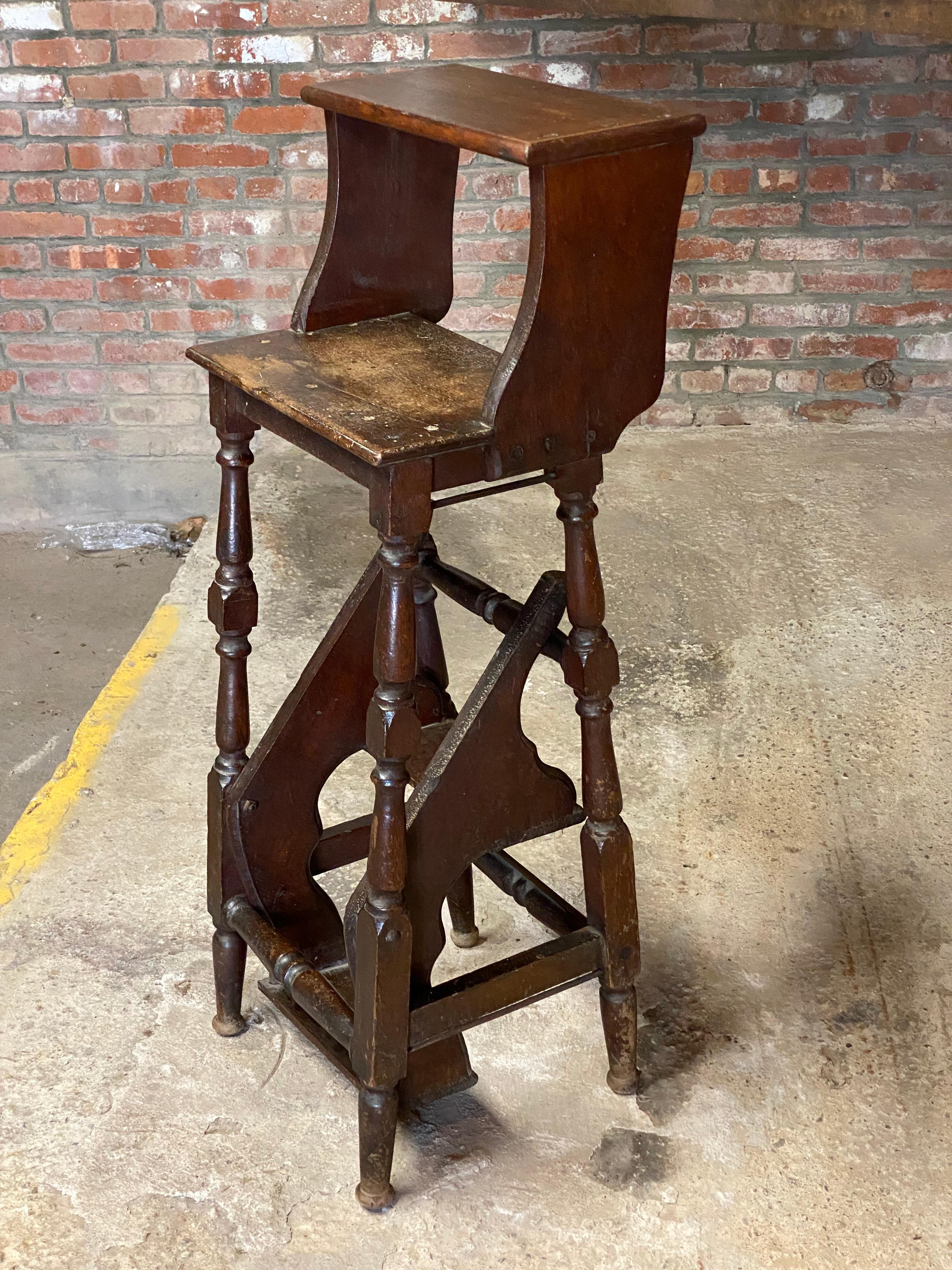 Elegant Victorian walnut fold out library step. The compact way of getting to those hard to reach books or objects on the highest shelf. Circa 1880-1900. When closed it could function as a high chair, stool or even a small shelf and when the lower