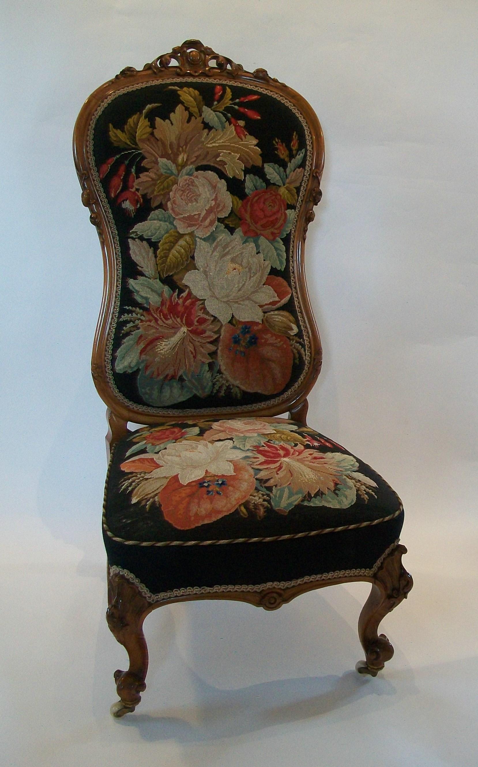 High Victorian walnut framed nursing / occasional chair with original needlepoint tapestry and decorative gimp cord - exceptional bench made hand carved quality frame with warm aged patina - featuring tapestry upholstery with flowers and tobacco