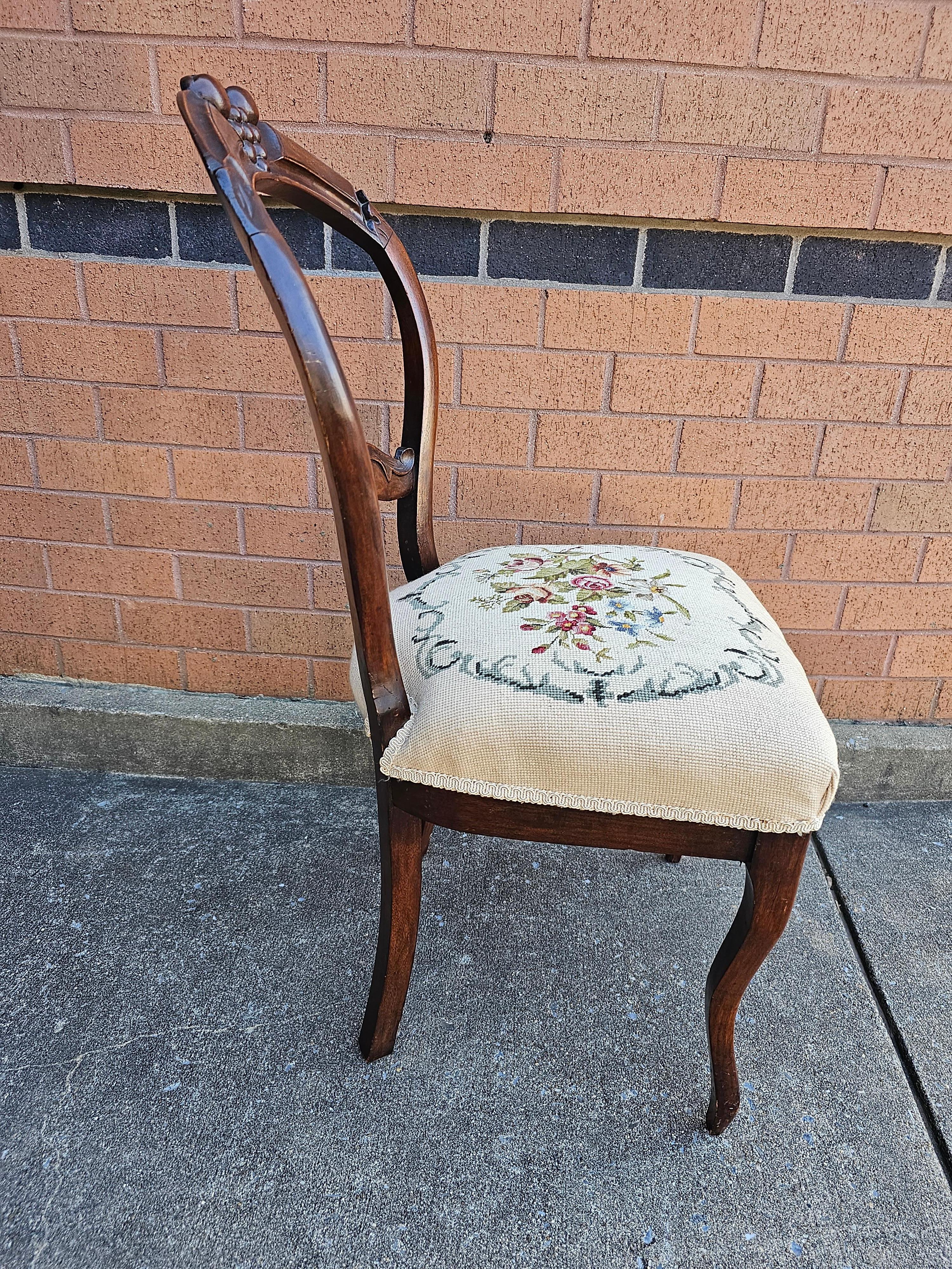 A gorgeous, fully refurbished Victorian Walnut Needlepoint Upholstered Side Chair in great antique condition. Very firm and comfortable seat. Measures 17