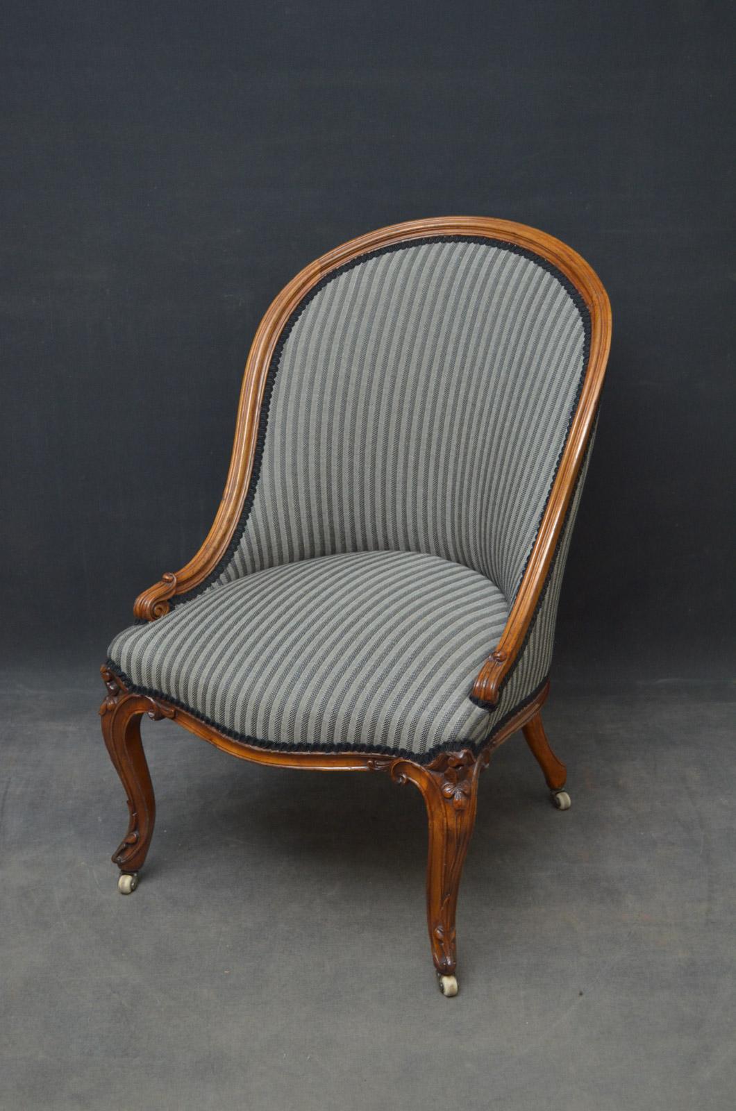Sn4556 Victorian walnut spoonback armchair with moulded and carved frame, serpentine front rail and carved cabriole legs, standing on original brass castors. This antique armchair retains its original finish, color and patina with new sprung seat