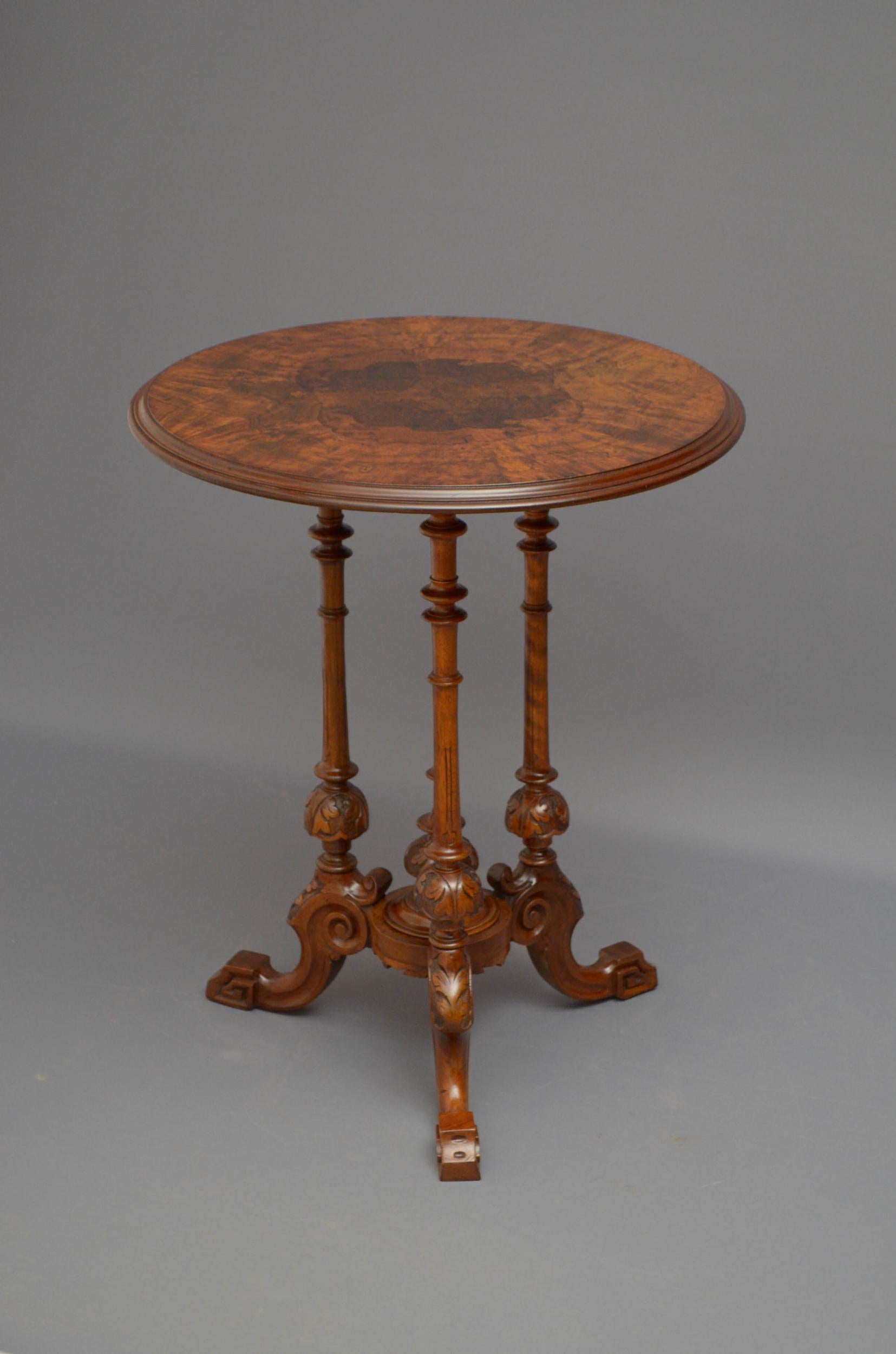 Sn5075 elegant Victorian burr walnut lamp table, having burr and figured walnut top with moulded edge above three turned and carved supports terminating in three carved cabriole legs. This antique table has been syamthetically restored and is in