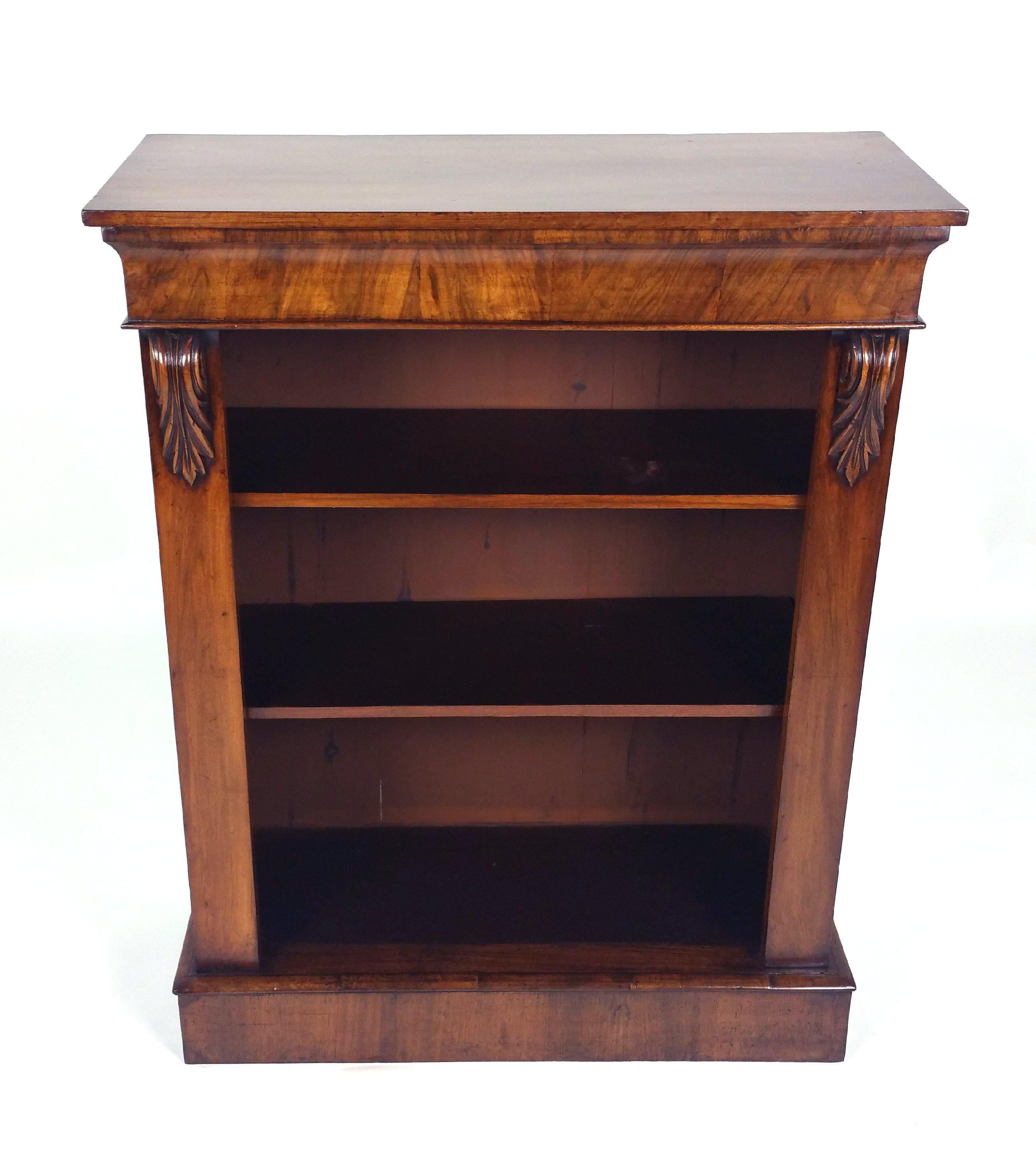 This very handsome Victorian walnut open bookcase features two shelves and is decorated with carved corbels and a shaped frieze. It measures 32 ½ in 82.5 cm wide, 14 in – 35.5 cm deep and 42 in – 106.8 cm in height. This very good quality and