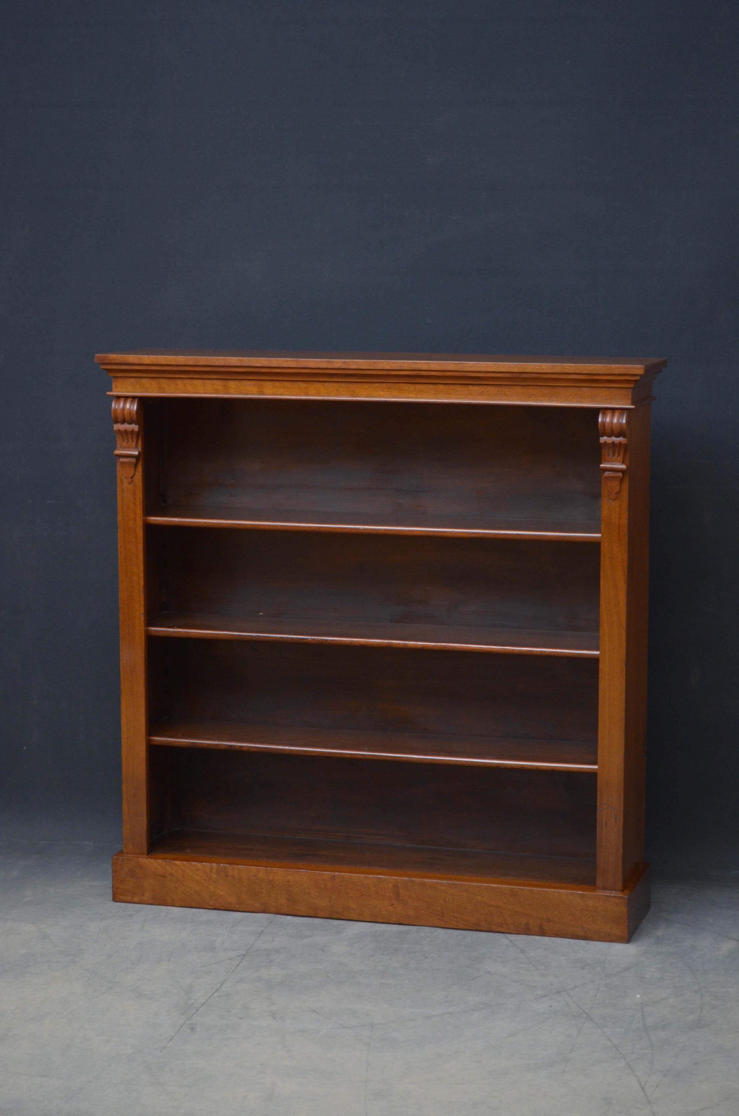Sn5199 victorian figured walnut bookcase, having figured top above three height adjustable shelves flanked by drop carvings, all standing on plinth base. This antique bookcase has been syamthetically restored and is ready to place at home.