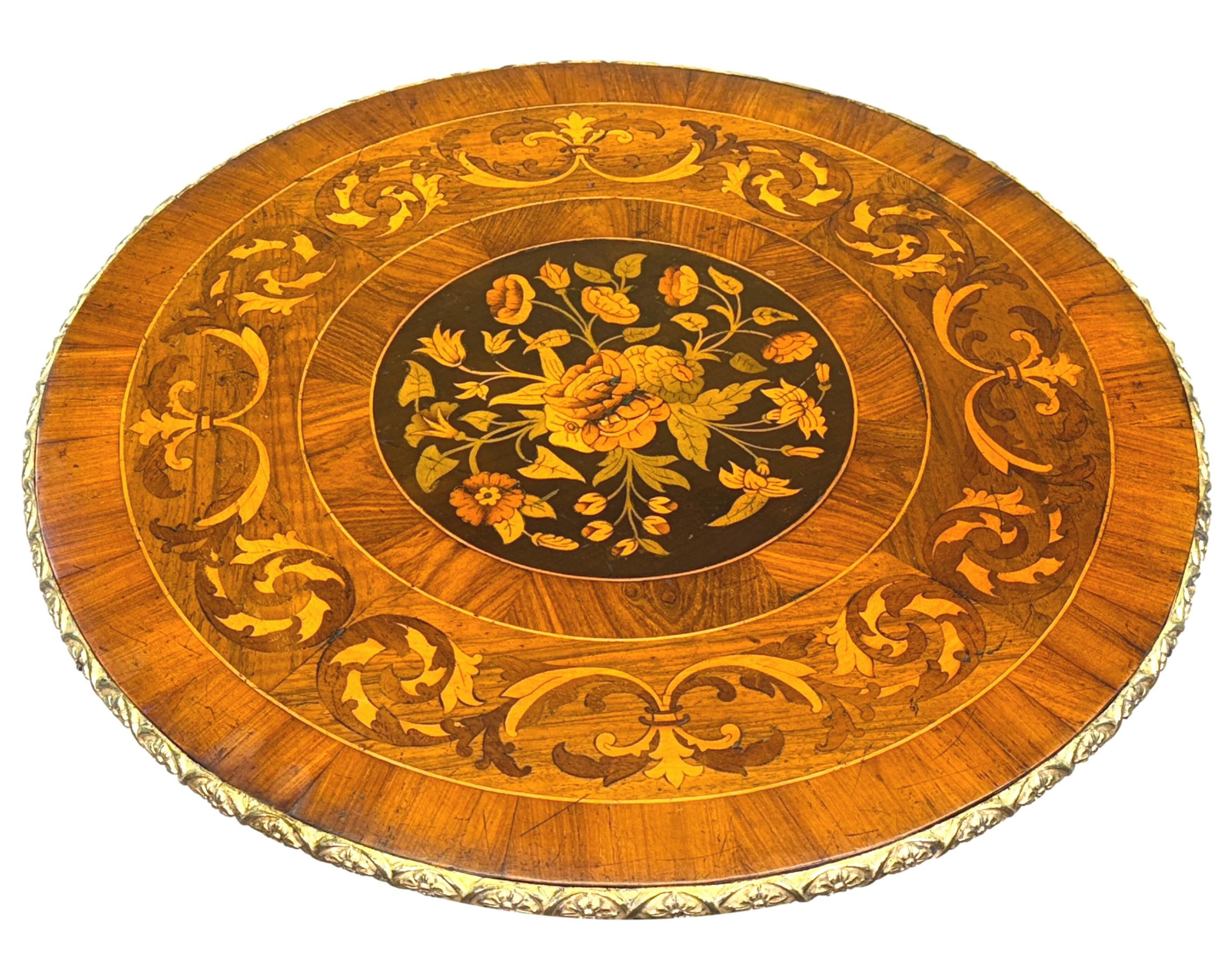 A Very Good Quality Mid 19th Century Walnut Circular Lamp Table, Having Superb Circular Top With Profuse Floral Marquetry Inlaid Decoration And Attractive Brass Mounted Decoration, Raised On Spiral Twist Turned Central Column Terminating On Elegant