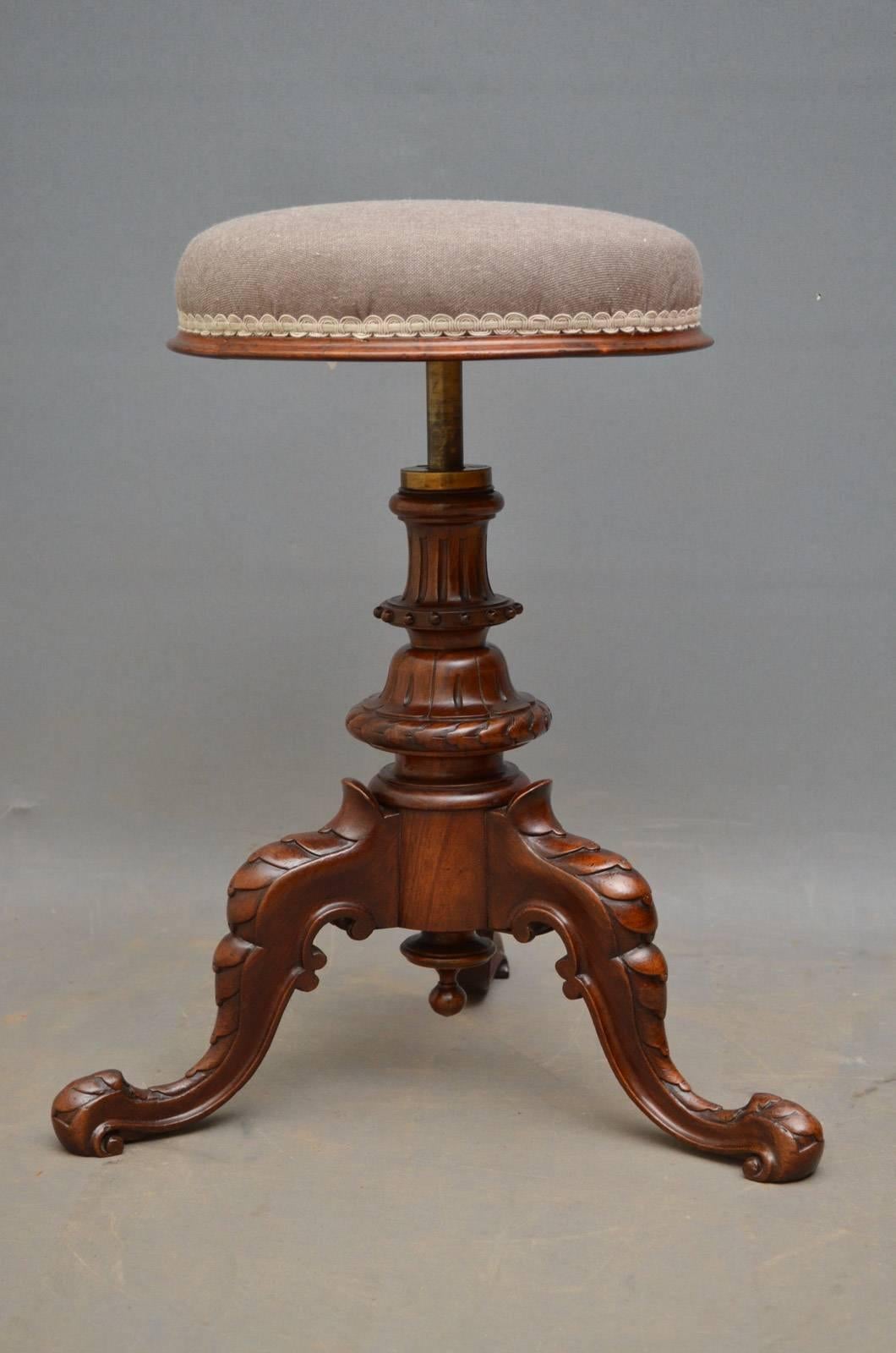 Sn4342, Victorian revolving dressing table stool, having height adjustable seat with new grey cover, standing on reeded and carved column terminating in three carved cabriole legs. This antique stool retains its original finish which has been