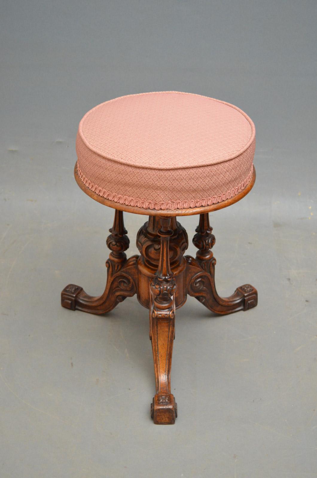 Sn4587 Victorian walnut revolving dressing table stool, having height adjustable seat on vase shaped column and 3 carved uprights terminating in 3 finely carved, downswpet legs. This antique stool retains its original finish, color and patina, circa