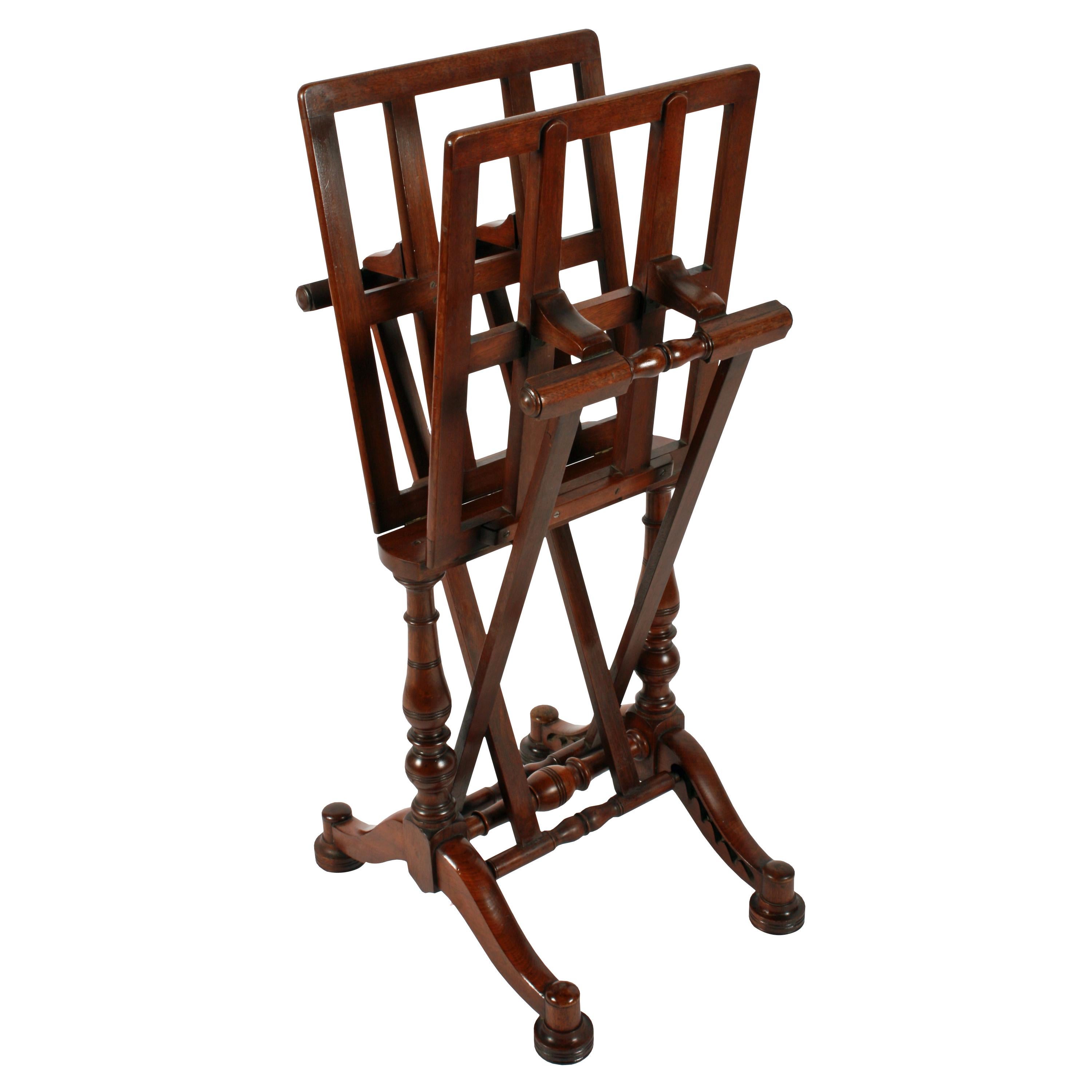 A 19th century Victorian solid walnut adjustable portfolio stand.

The stand has four shaped legs raised on bun feet with hidden casters underneath.

The portfolio holder has adjustable supports to each side which can be raised and lowered as