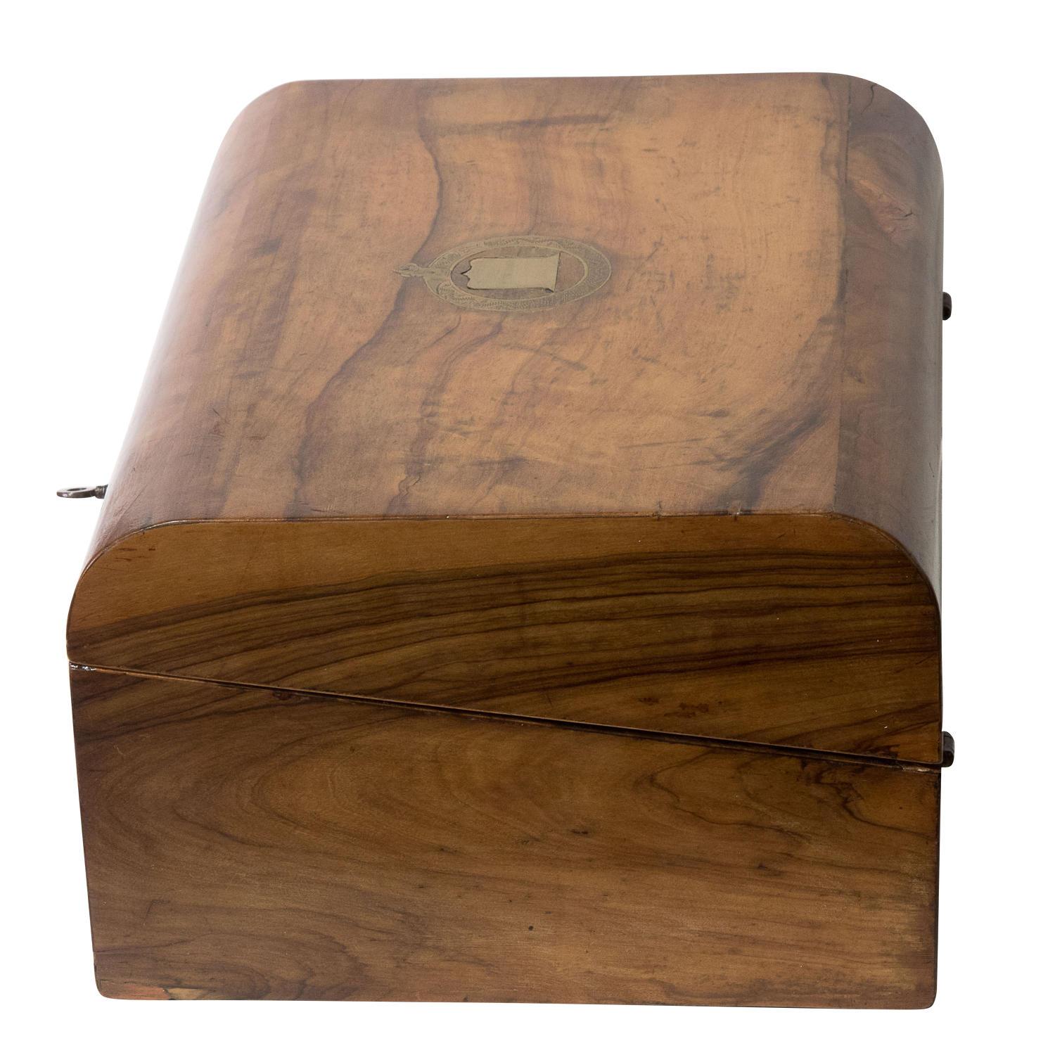 A Victorian walnut writing slope, circa 1860.